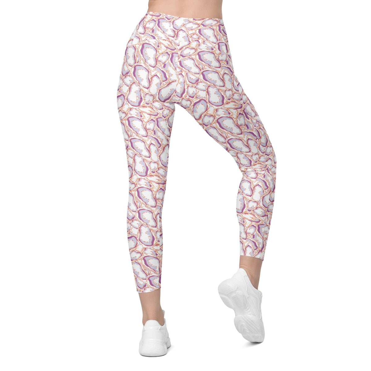 A person wearing high-waisted leggings with an abstract floral or geode-like print in white, pink, purple, and orange, paired with white sneakers, shown against a plain white background. Elegant Organic Marble Stone Leggings with Pockets Activewear Shop Elegant Organic Marble Stone Leggings with Pockets, designed for all-day comfort, flexible movement, and standout style. Elevate your activewear with Elegant Organic Marble Stone Leggings with Pockets, blending bold marble style, comfort, and function.