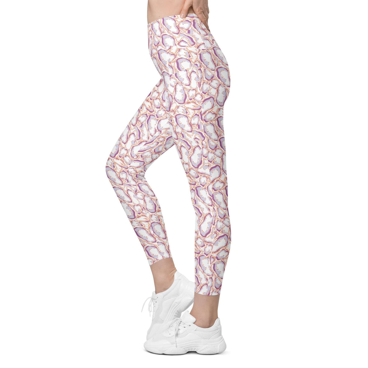 A person modeling high-waisted leggings with an abstract paisley-like pattern in white, pink, purple, and orange, paired with white sneakers on a plain white background. Elegant Organic Marble Stone Leggings with Pockets Activewear Shop Elegant Organic Marble Stone Leggings with Pockets, designed for all-day comfort, flexible movement, and standout style. Elevate your activewear with Elegant Organic Marble Stone Leggings with Pockets, blending bold marble style, comfort, and function.