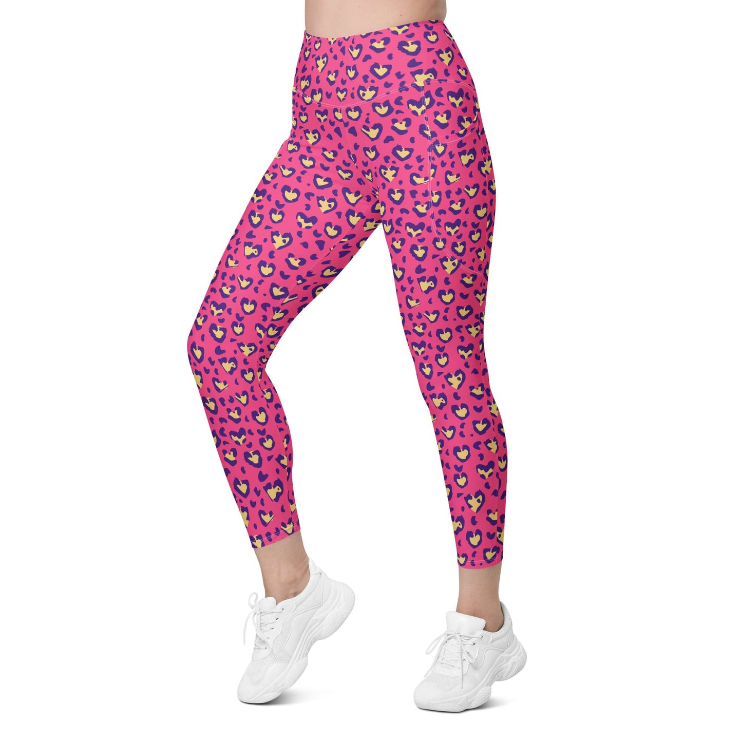 Pink high-waisted leggings with a colorful leopard print pattern, shown on a model from the waist down wearing white sneakers against a plain white background. Heart Pink Leopard Pattern Leggings with Pockets Activewear Shop Heart Pink Leopard Pattern Leggings with Pockets Activewear, designed for bold workouts, everyday comfort, and convenient storage. Upgrade your workout wardrobe with Heart Pink Leopard Pattern Leggings with Pockets Activewear—stylish, practical, and made to move.