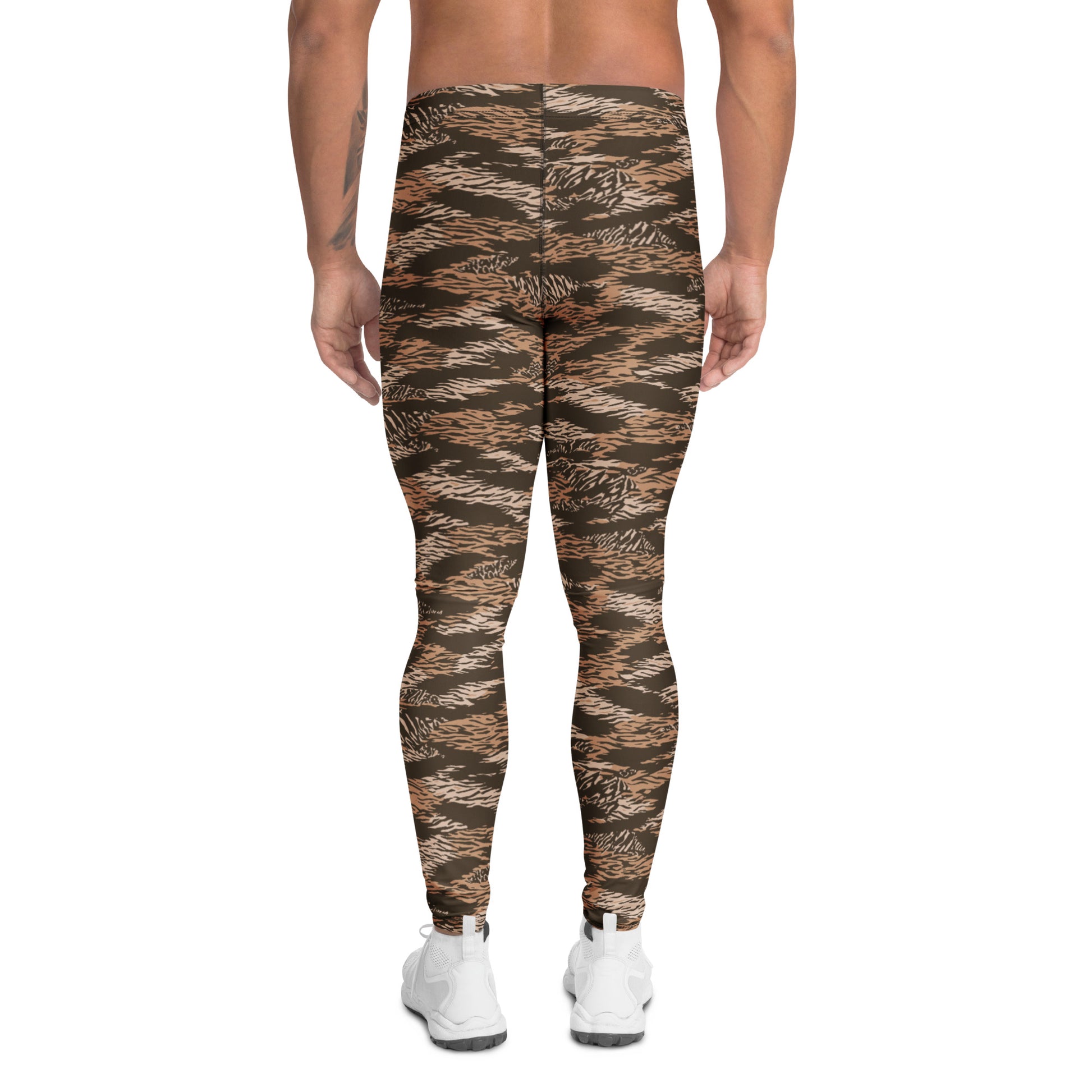 Rear view of a model wearing high-waisted tiger-stripe camouflage leggings in brown, beige, and black, paired with white sneakers on a white background. Artistic Comfortable Bold Brown Tiger Stripes Men's Athletic Leggings