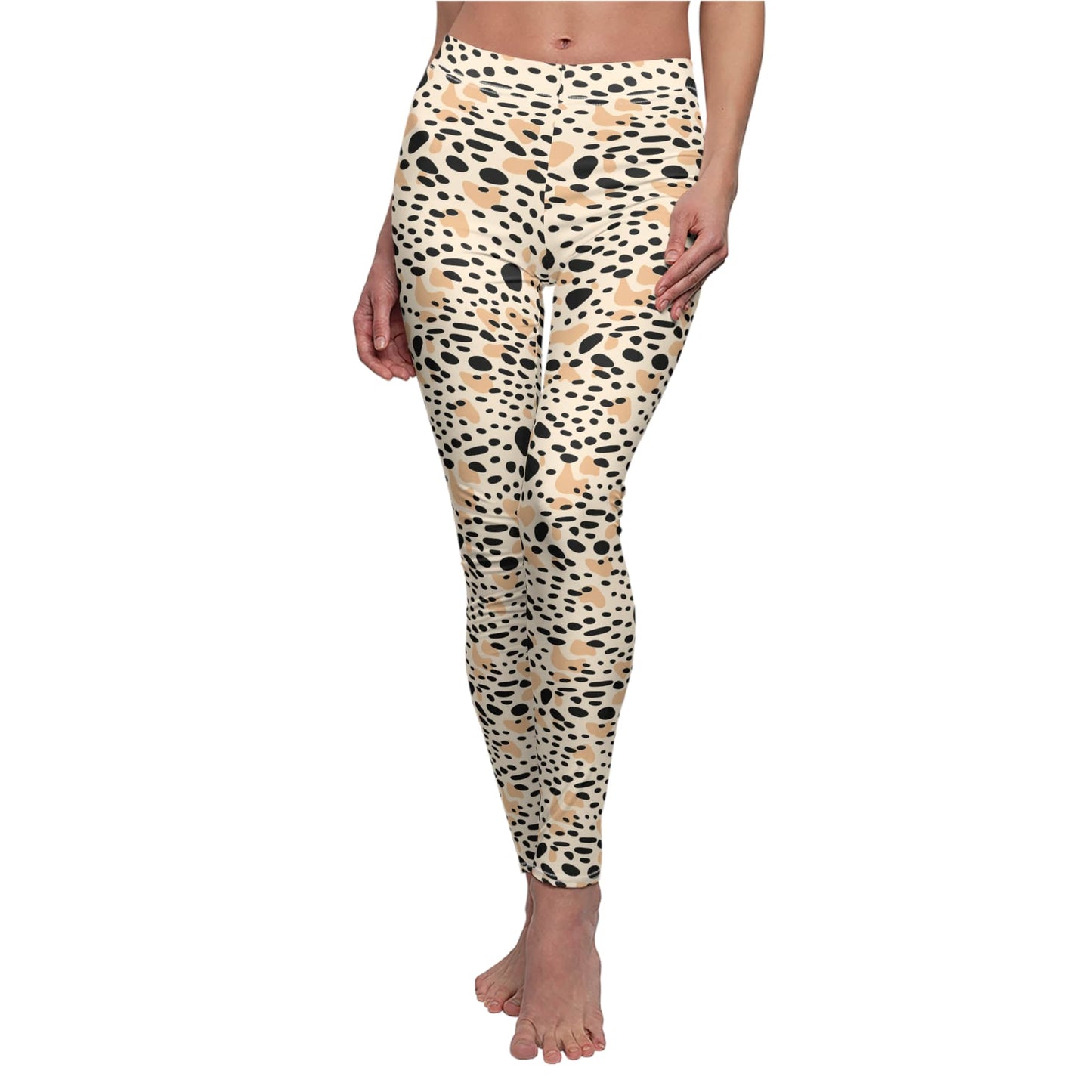 A person modeling high-waisted leggings with an abstract organic spot pattern in beige, black, and brown on a plain white background. Bold Beige and Black Spots Leopard Print Leggings Activewear