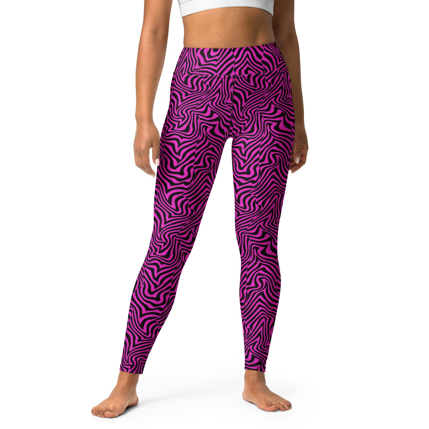 A model wearing high-waisted leggings with a vibrant magenta and dark purple wavy zebra-like pattern, shown from the waist down on a white studio background. Bold Fashion Yoga Leggings Modern Psychedelic Art