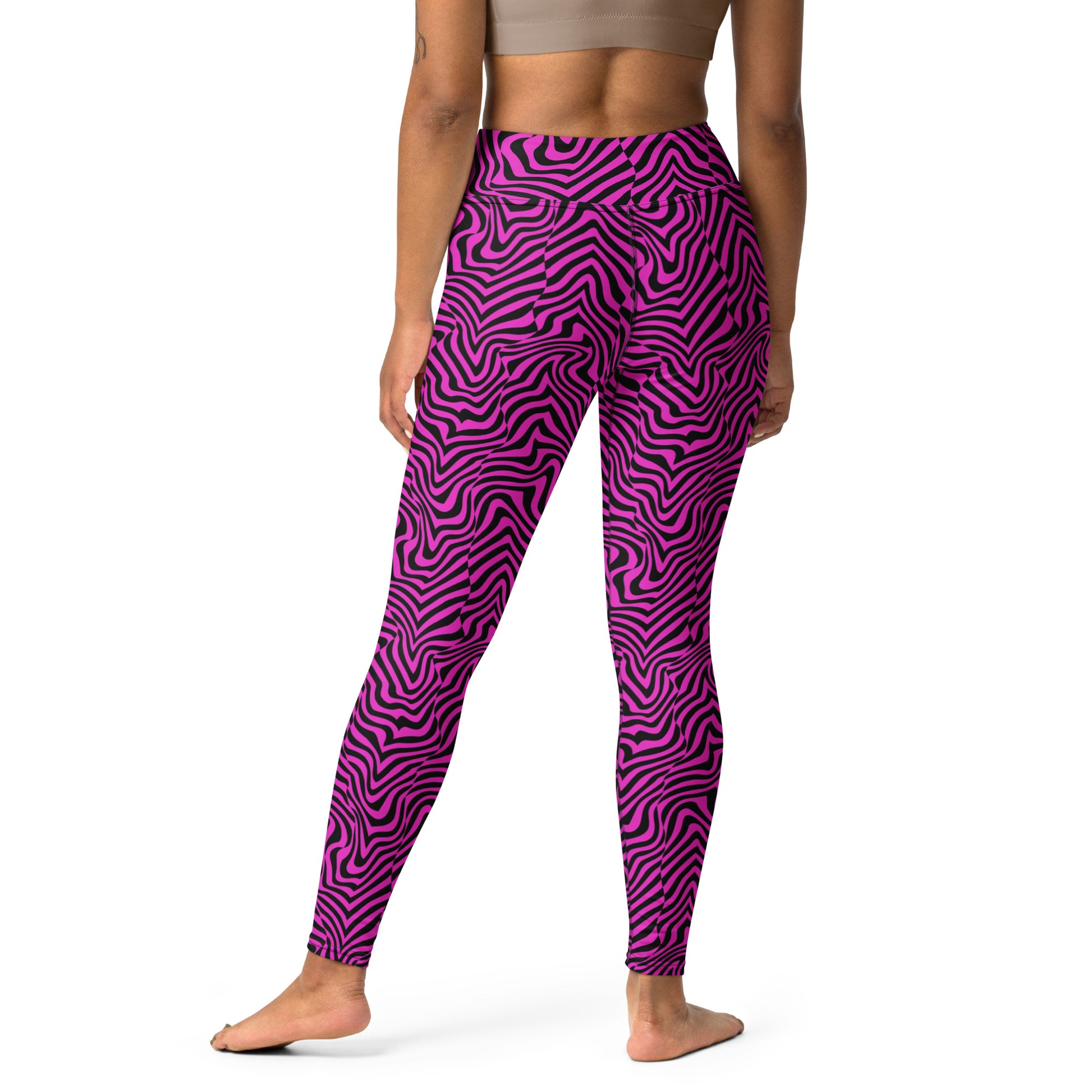 A model from the back wearing high-waisted leggings with a vibrant magenta and dark purple wavy zebra-like pattern, set against a plain white background. Bold Fashion Yoga Leggings Modern Psychedelic Art Activewear