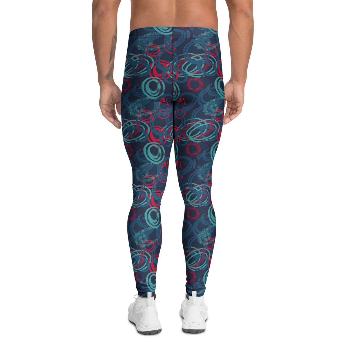 A person shown from the back wearing patterned leggings with a dark navy base and abstract teal and red circular swirls, paired with white sneakers on a plain white background. Bold Vibrant Geometric Shapes Men's Athletic Leggings Activewear