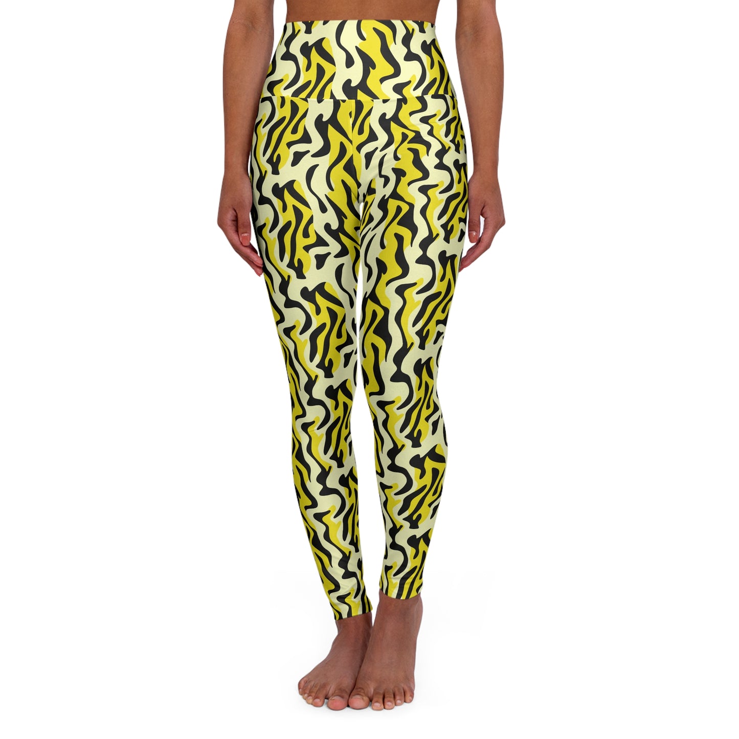 A model wearing high-waisted leggings with a bold yellow, black, and off-white wavy abstract pattern, shown from the waist down against a plain white background. Bold Yellow and Black Zebra Print Yoga Leggings Casual Wear