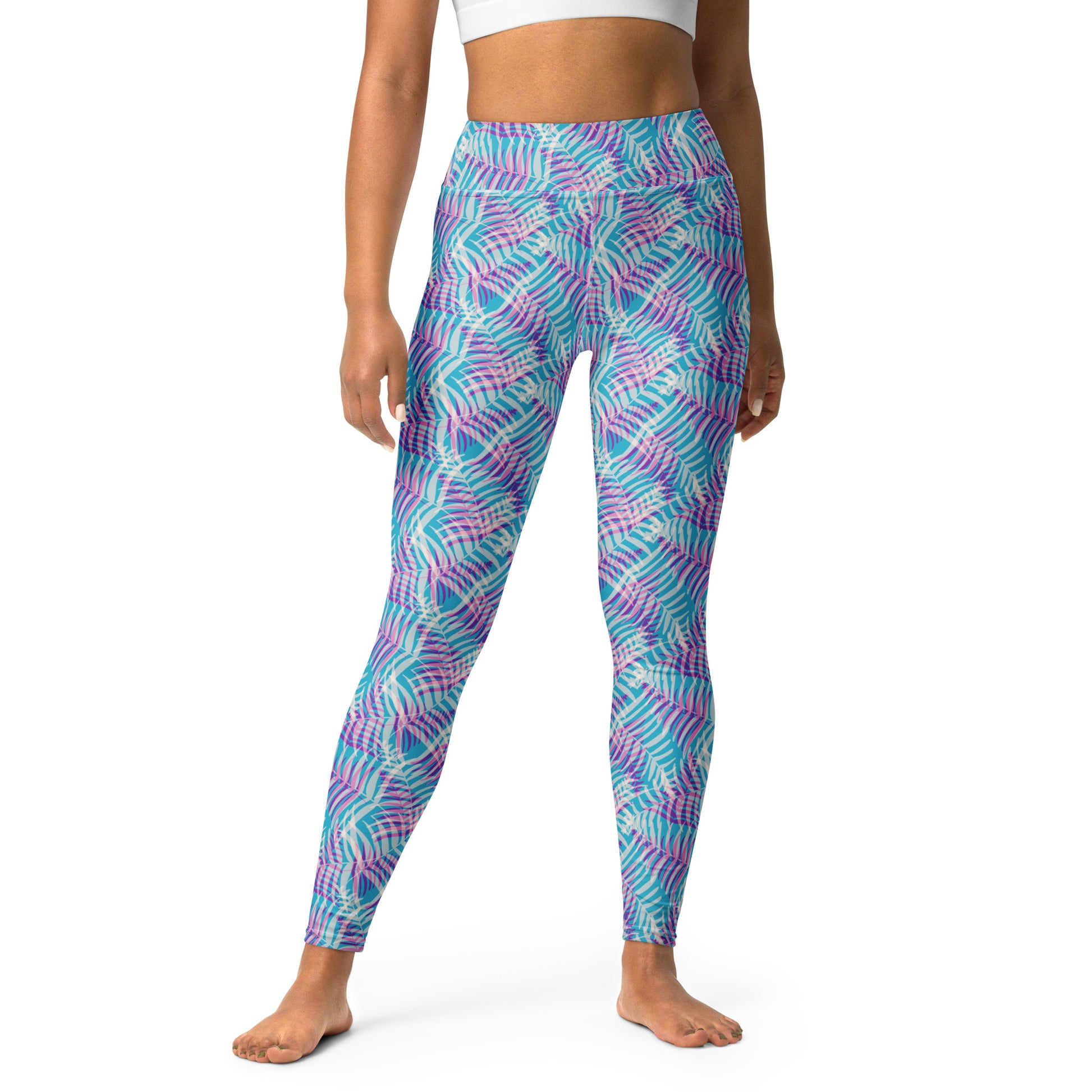 A model wearing high-waisted leggings with a vibrant abstract pattern in turquoise, purple, and pink, shown against a plain white background. Chic Bold Pastel Palm Print Activewear Yoga Leggings
