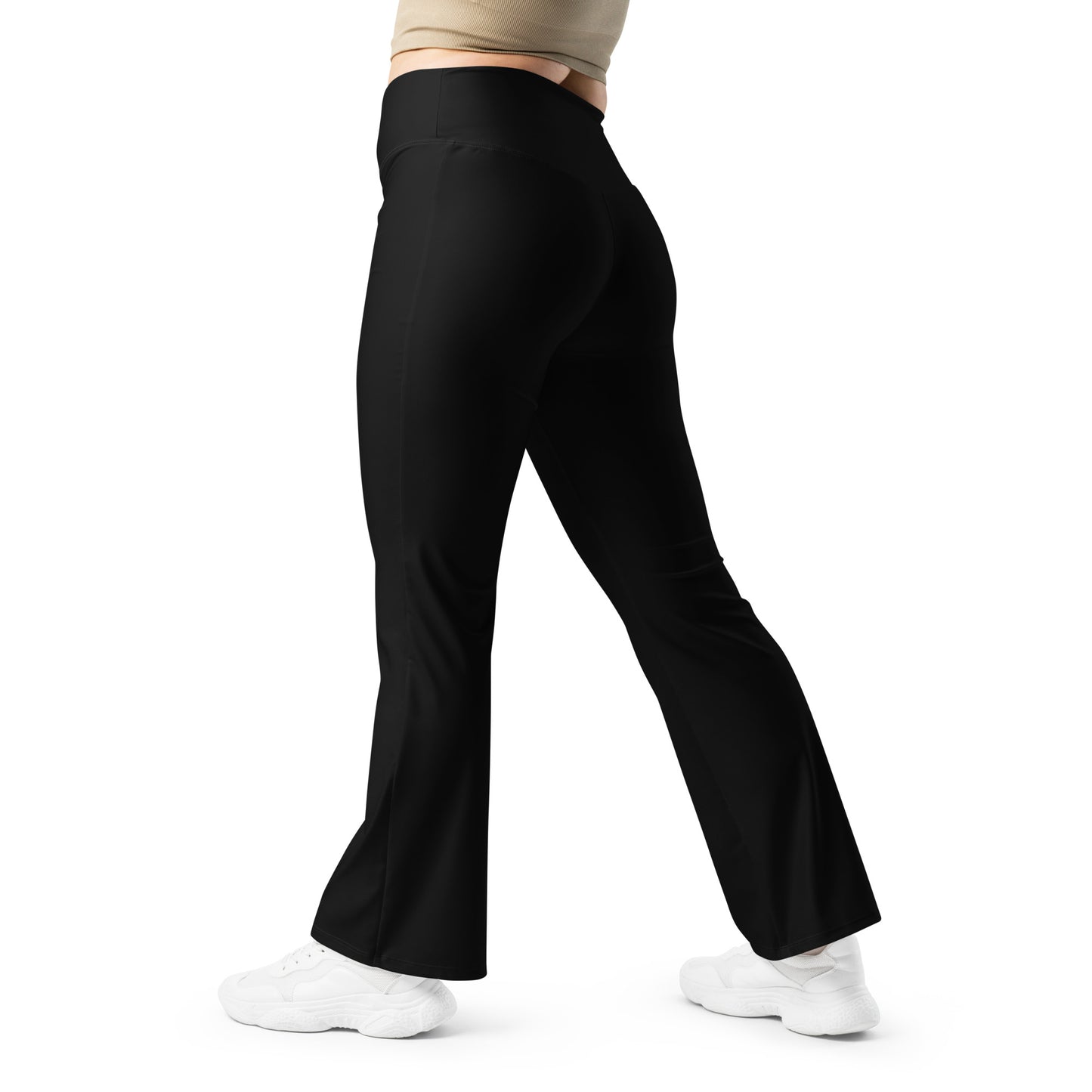 Black flared pants worn by a person on a white background Chic Minimalist Solid Black Flare Leggings for Activewear