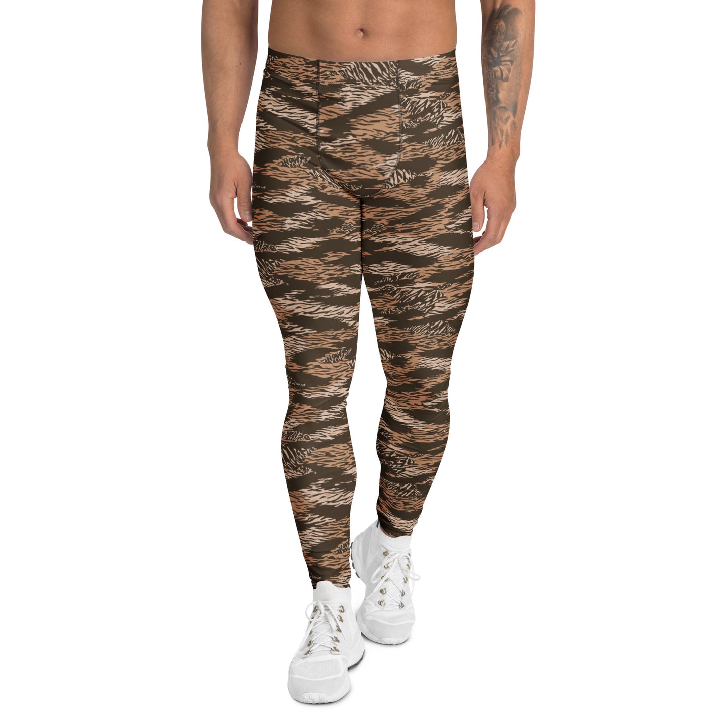 A model from the waist down wearing high-waisted, slim-fit leggings with a brown and black tiger-stripe camouflage pattern, paired with white sneakers, on a solid white background. Comfortable Bold Brown Tiger Stripes Men's Athletic Leggings