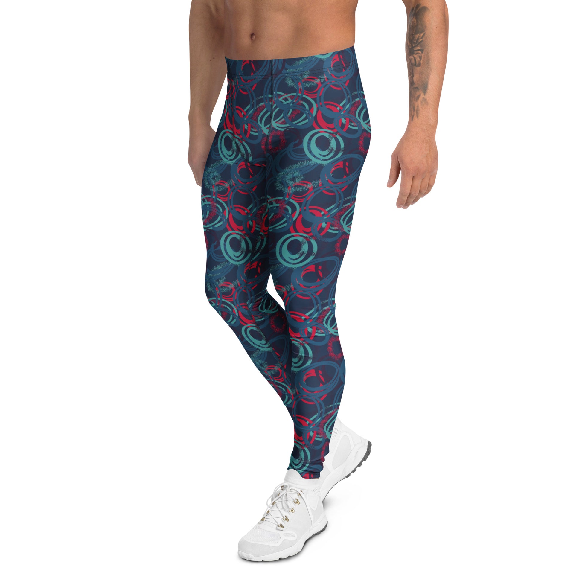 A model wearing high-waisted athletic leggings with a dark blue background and a red and teal abstract swirl pattern, paired with white sneakers against a plain white background. Comfortable Bold Vibrant Geometric Shapes Men's Athletic Leggings Activewear