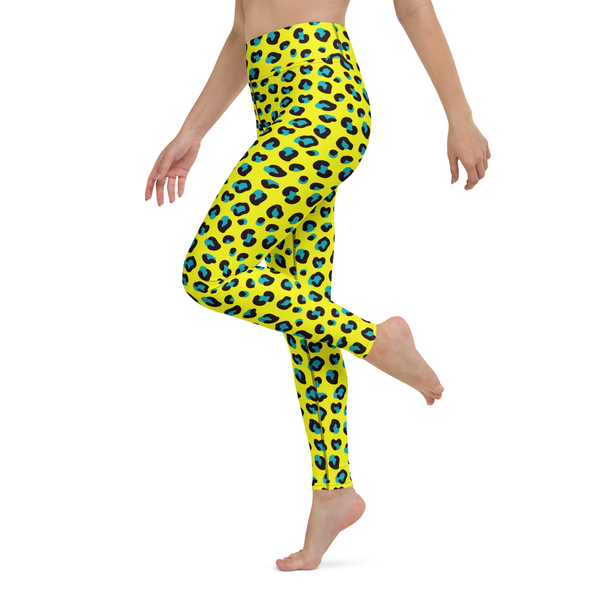 A model wearing bright yellow leggings with a bold black and blue leopard print, shown from the waist down in a side-profile pose against a plain white background. Comfortable Bold Yellow Teal Leopard Print Yoga Leggings for Activewear