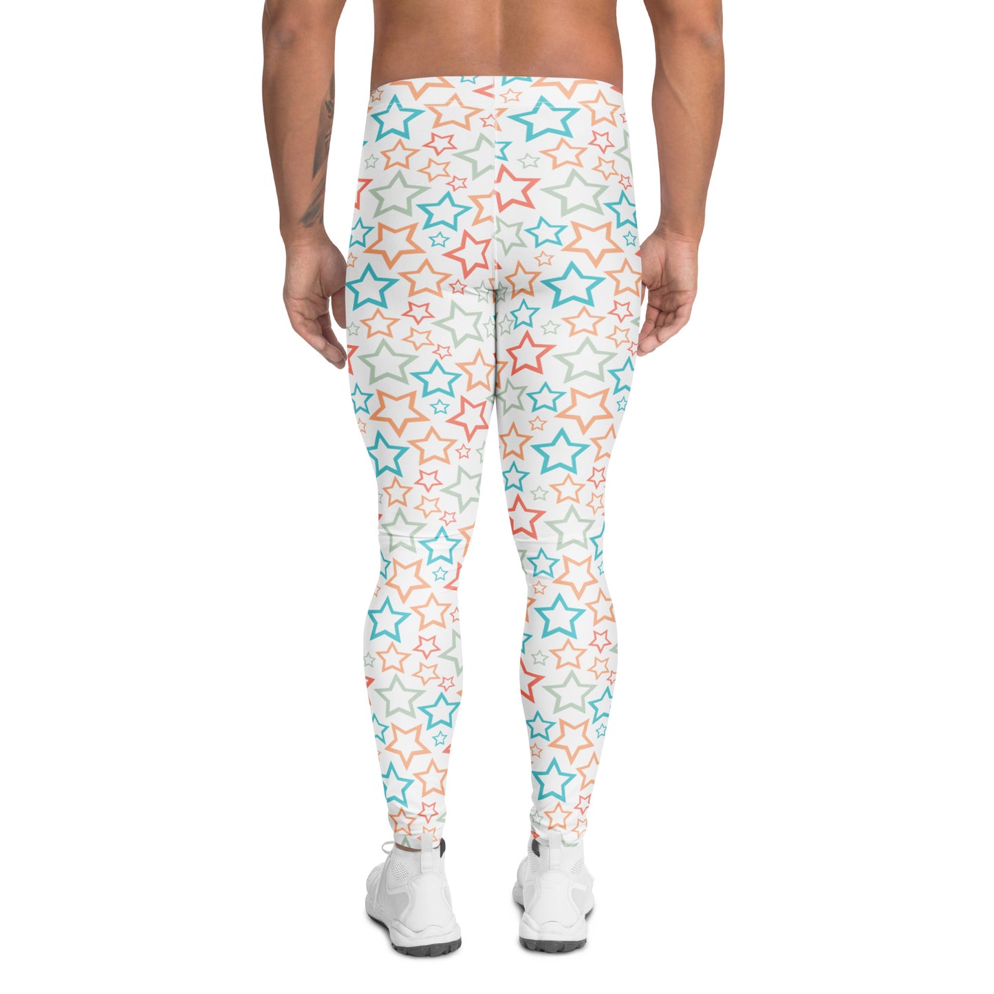 A person shown from the back wearing high-waisted leggings with an allover star pattern in light blue, coral orange, and gray on a white base, paired with white sneakers against a plain white background.