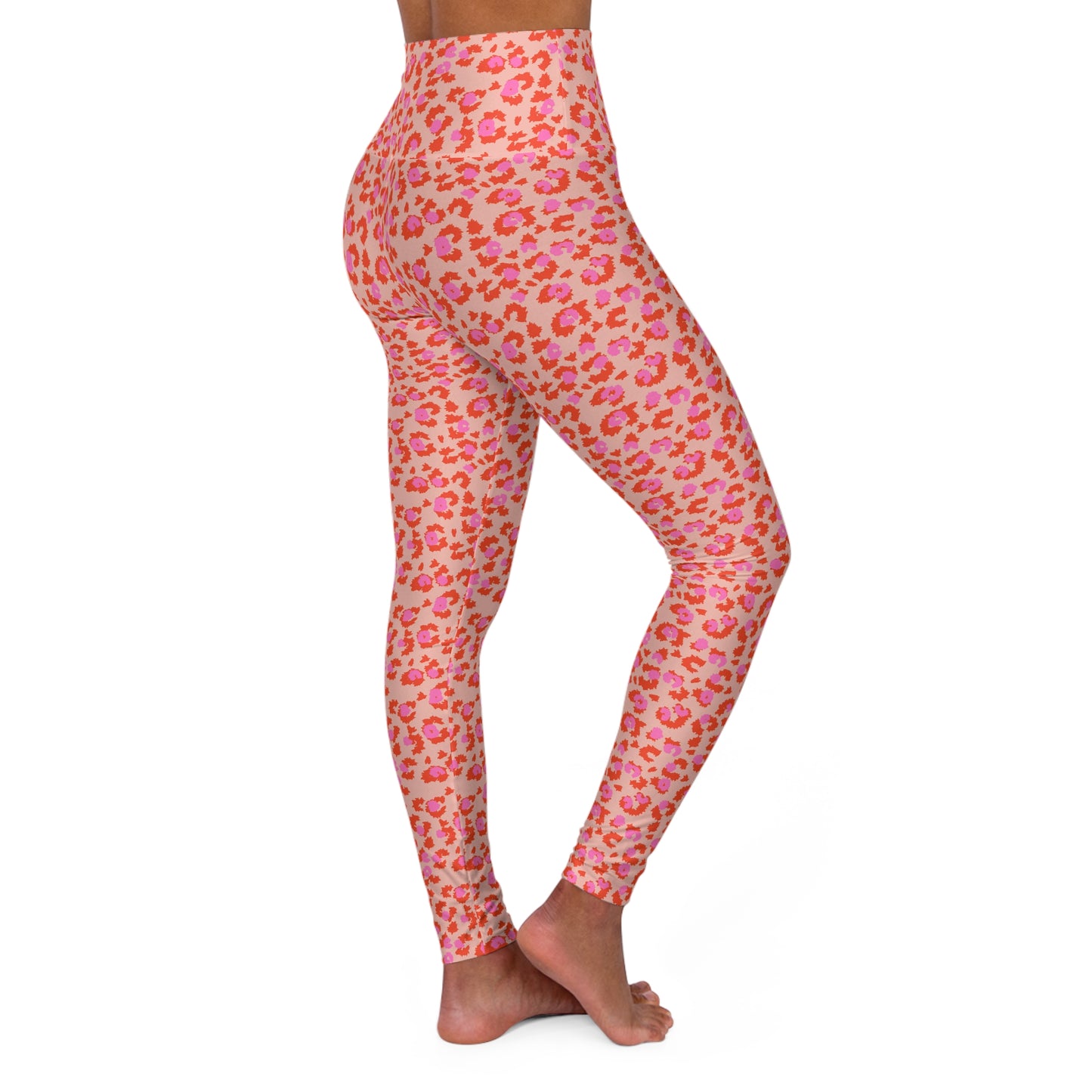 Pink and orange leopard print high-waisted leggings shown on a model from the side against a white background. Comfortable High-Waisted Yoga Pants with Chic Pink Leopard Print