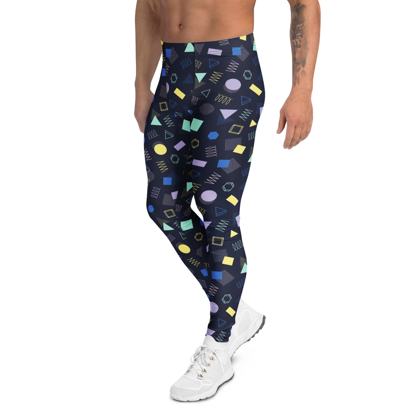 A model wearing high-waisted athletic leggings with a colorful 90s geometric pattern on a dark navy background, paired with white sneakers against a plain white studio background. Comfortable Minimalist Bold Aesthetic Geometric Memphis Men's Leggings for Activewear