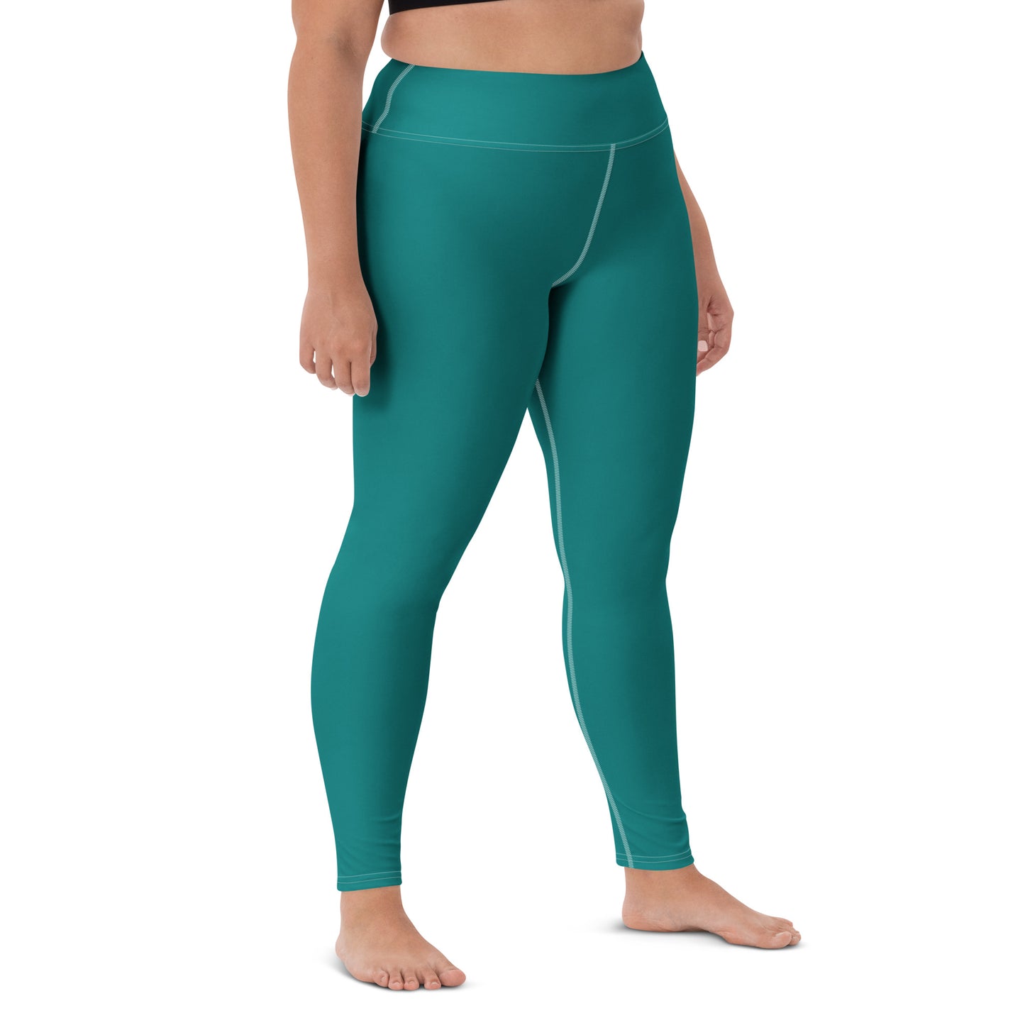 A person modeling high-waisted teal leggings against a plain white studio background, shown from the waist down with bare feet. Comfortable Minimalist Plain Solid Color Teal Yoga Leggings for Activewear