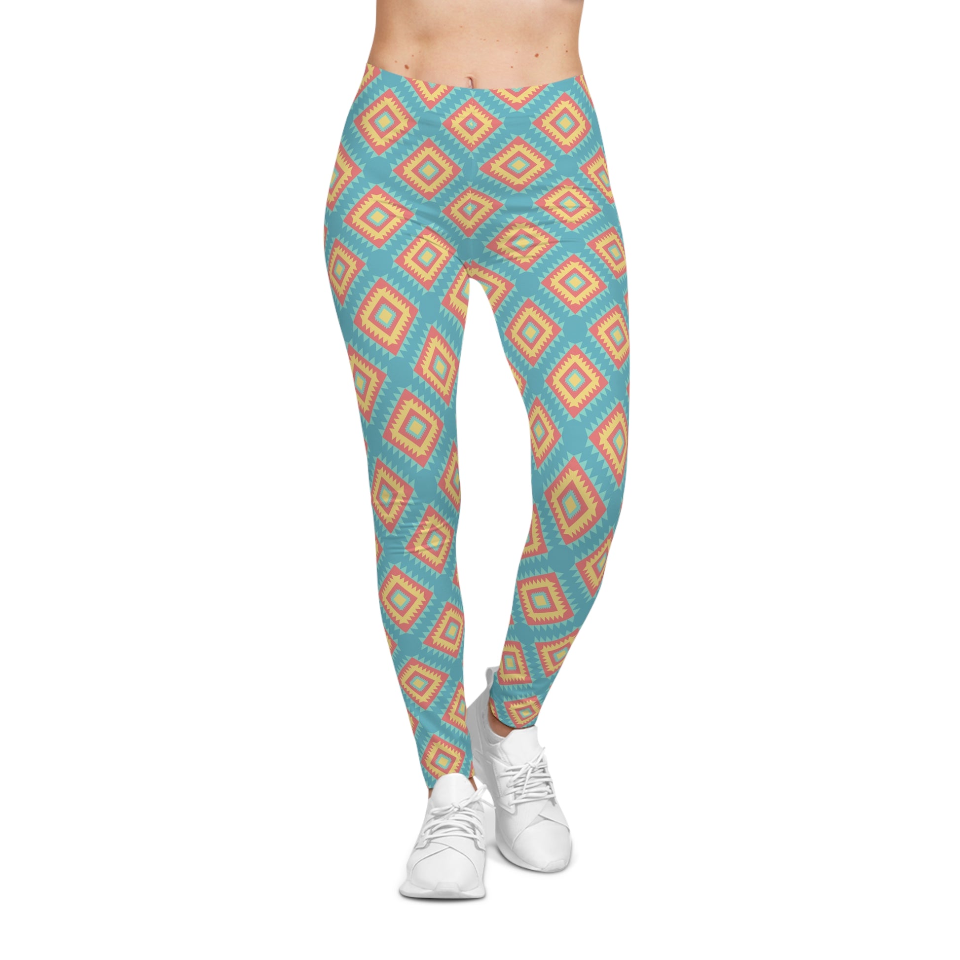 A person wearing high-waisted leggings with a repeating geometric diamond pattern in turquoise blue, orange, and beige, paired with white sneakers against a plain white background.