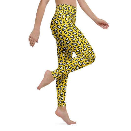 A model wearing high-waisted yellow leggings with a black and white leopard print pattern, shown from the waist down in a side-profile pose against a white background. Comfortable Yoga Leggings Bold Yellow Leopard Skin