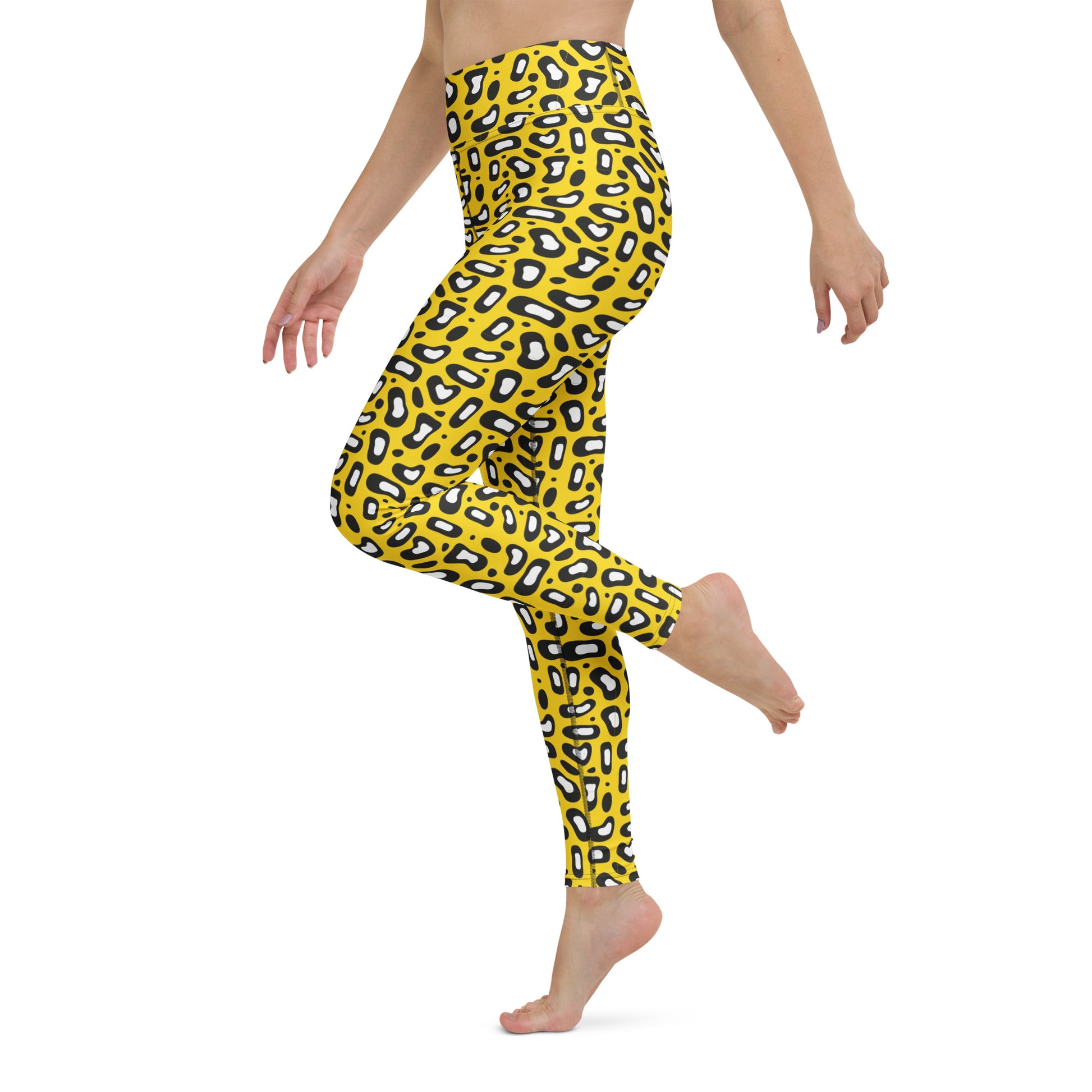 A model wearing bright yellow leggings with a black and white leopard print pattern, shown from the waist down in a side-profile pose against a plain white background. Comfortable Yoga Leggings Bold Yellow Leopard Skin Print Activewear