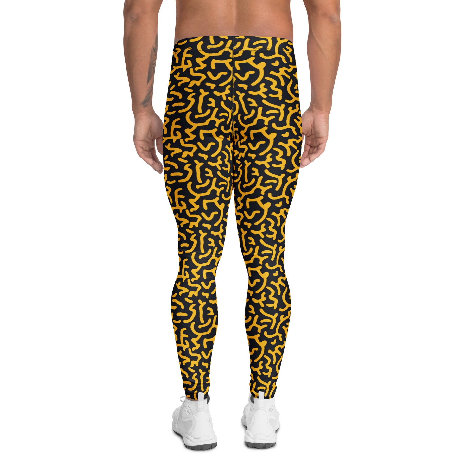 A person shown from the back wearing black leggings with a bold yellow abstract maze-like pattern, paired with white sneakers, on a plain white background. Contemporary Bold Gold Geometric Leggings for Men's Activewear