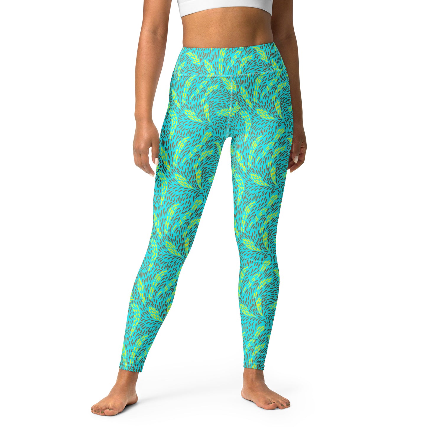 A model wearing high-waisted leggings with a vibrant blue and lime green abstract pattern, shown from the waist down on a white background. Contemporary Bold Swirl Print Yoga Leggings Activewear