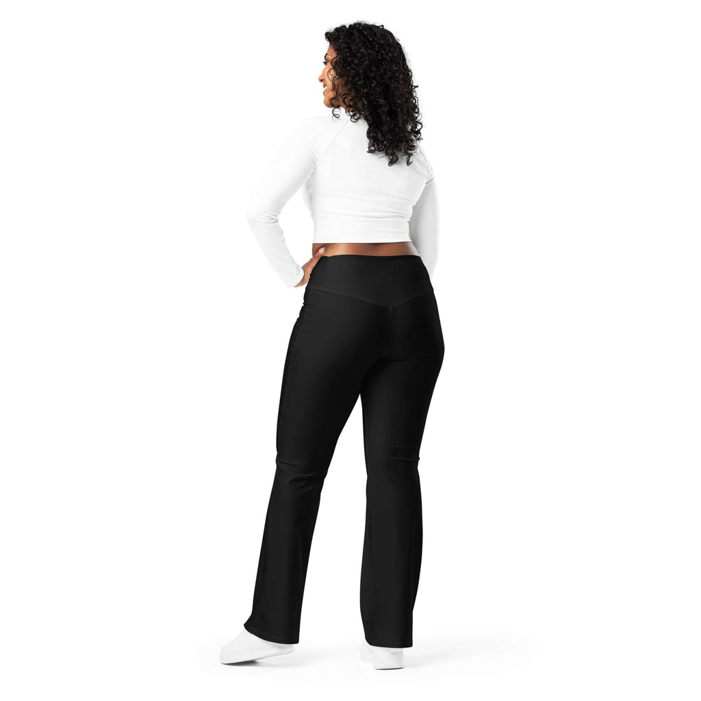 Woman wearing black leggings with 'No Brakes' text and a white crop top on a white background Cute Minimalist Solid Black Flare Leggings for Activewear