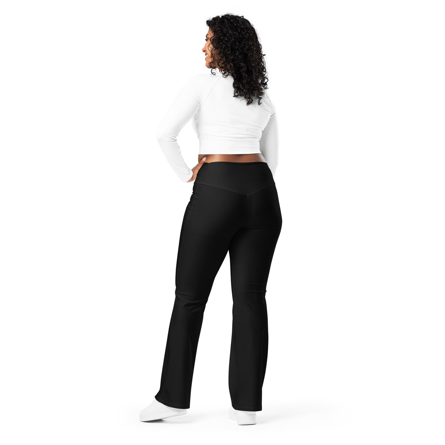 Woman wearing black leggings with 'No Brakes' text and a white crop top on a white background Cute Minimalist Solid Black Flare Leggings for Activewear
