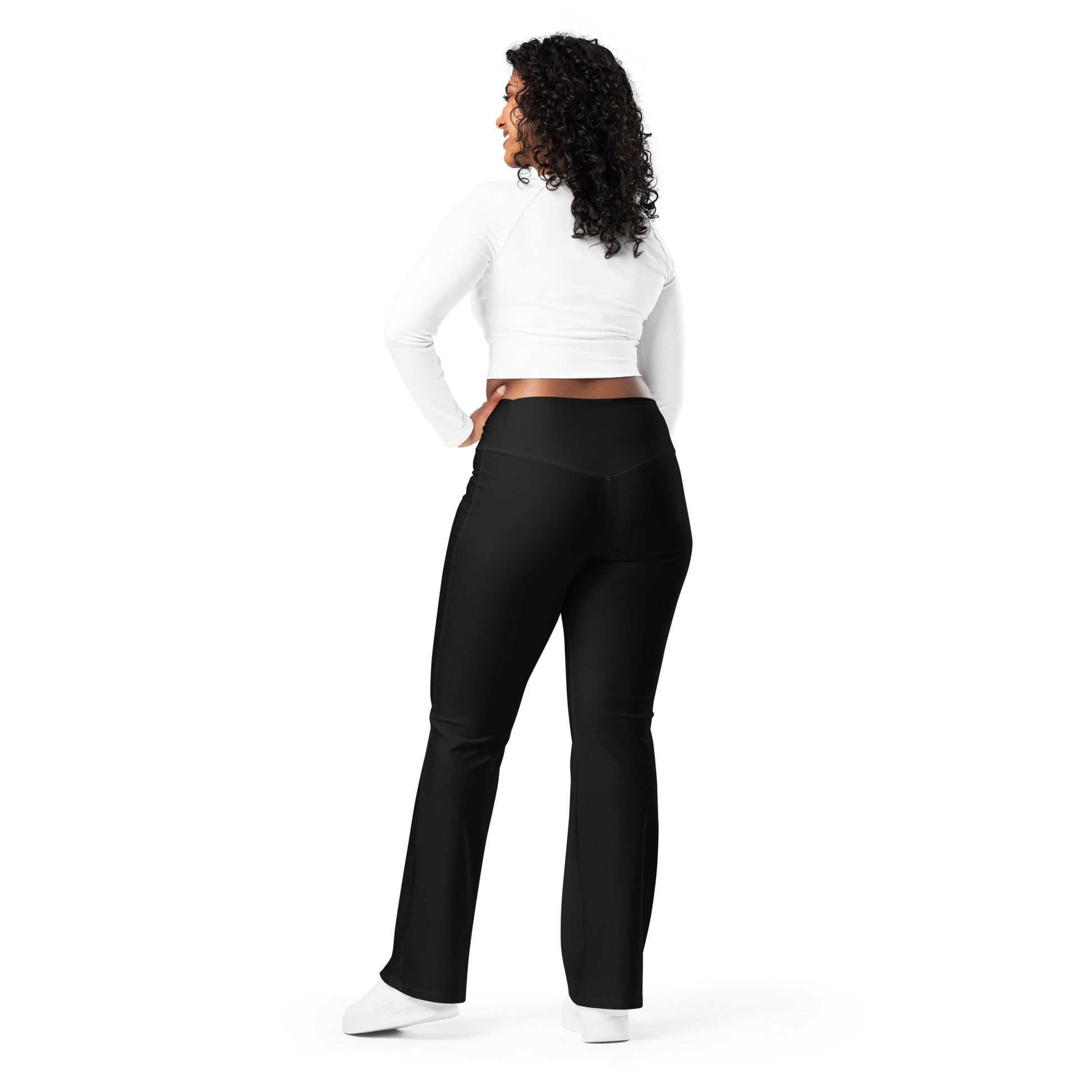 Woman wearing black leggings with 'No Brakes' text and a white crop top on a white background Cute Minimalist Solid Black Flare Leggings for Activewear