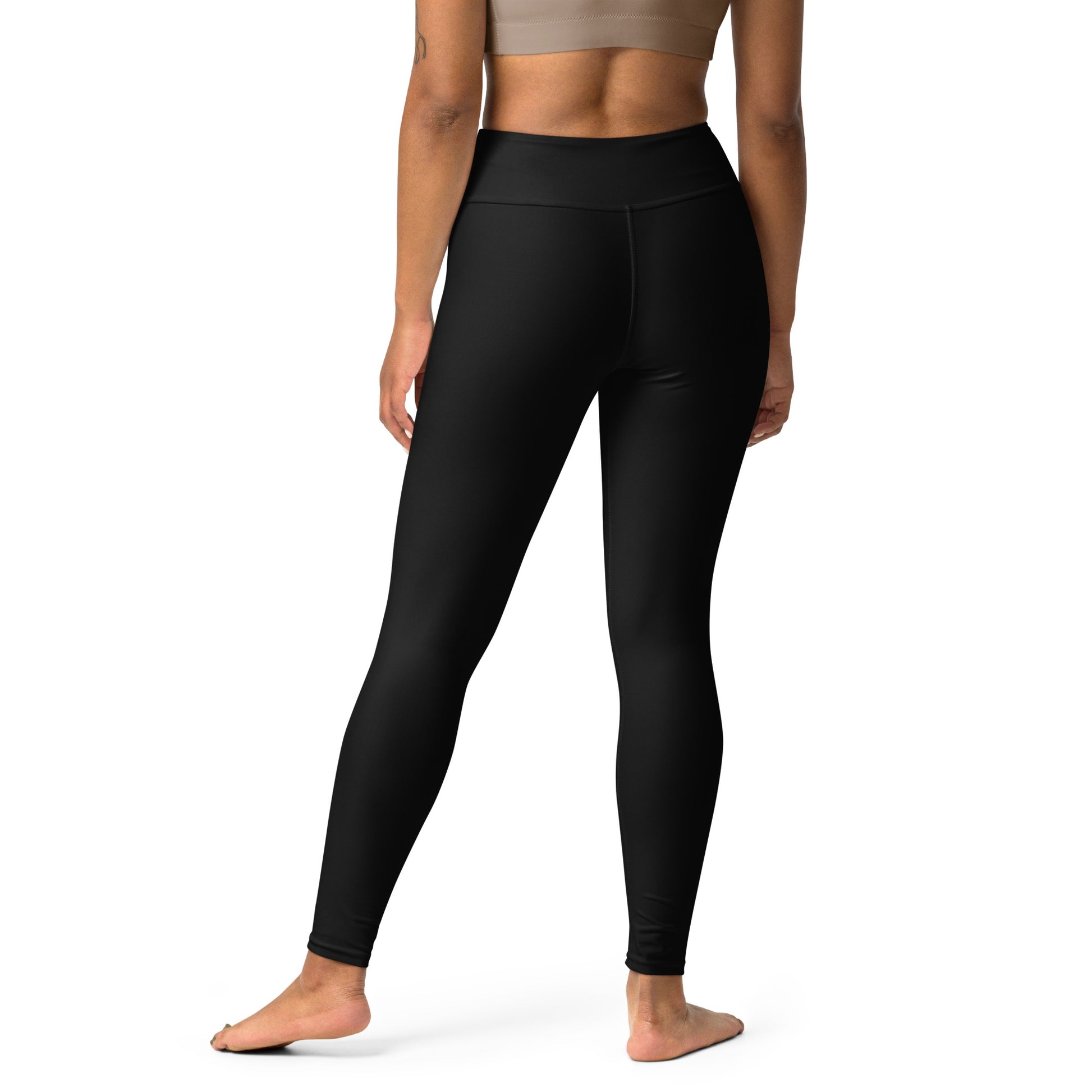 Person wearing black leggings with 'Essanza Le Peau' branding on a white background Durable Comfortable Essential Solid Black Yoga Pants for Activewear