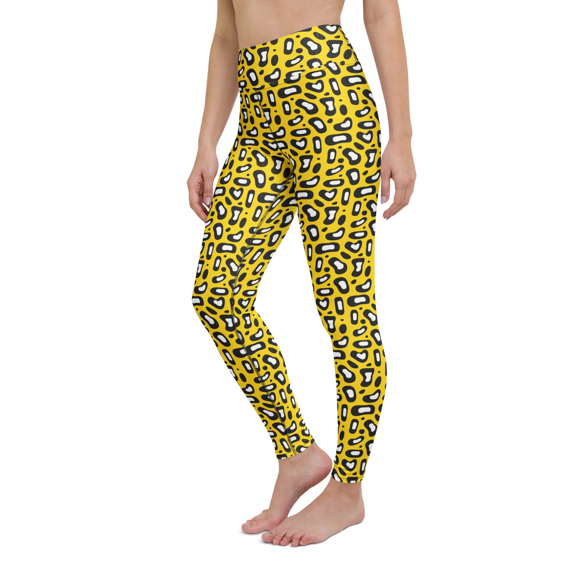 Yellow high-waisted leggings with a black and white leopard print pattern, shown on a model against a plain white background. Durable Comfortable Yoga Leggings Bold Yellow Leopard Skin Print Activewear