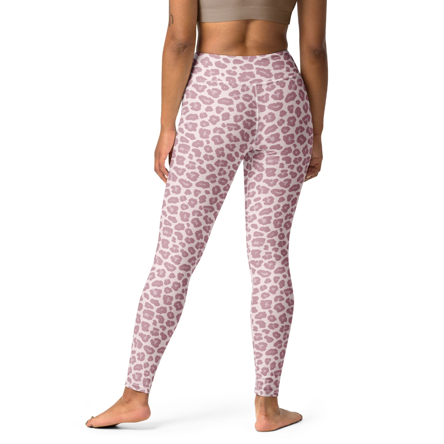 A model from the back wearing high-waisted leggings with a dusty pink and white leopard print pattern, shown against a plain white background. Elegant Chic Pink Leopard Pattern Pastel Yoga Leggings Activewear