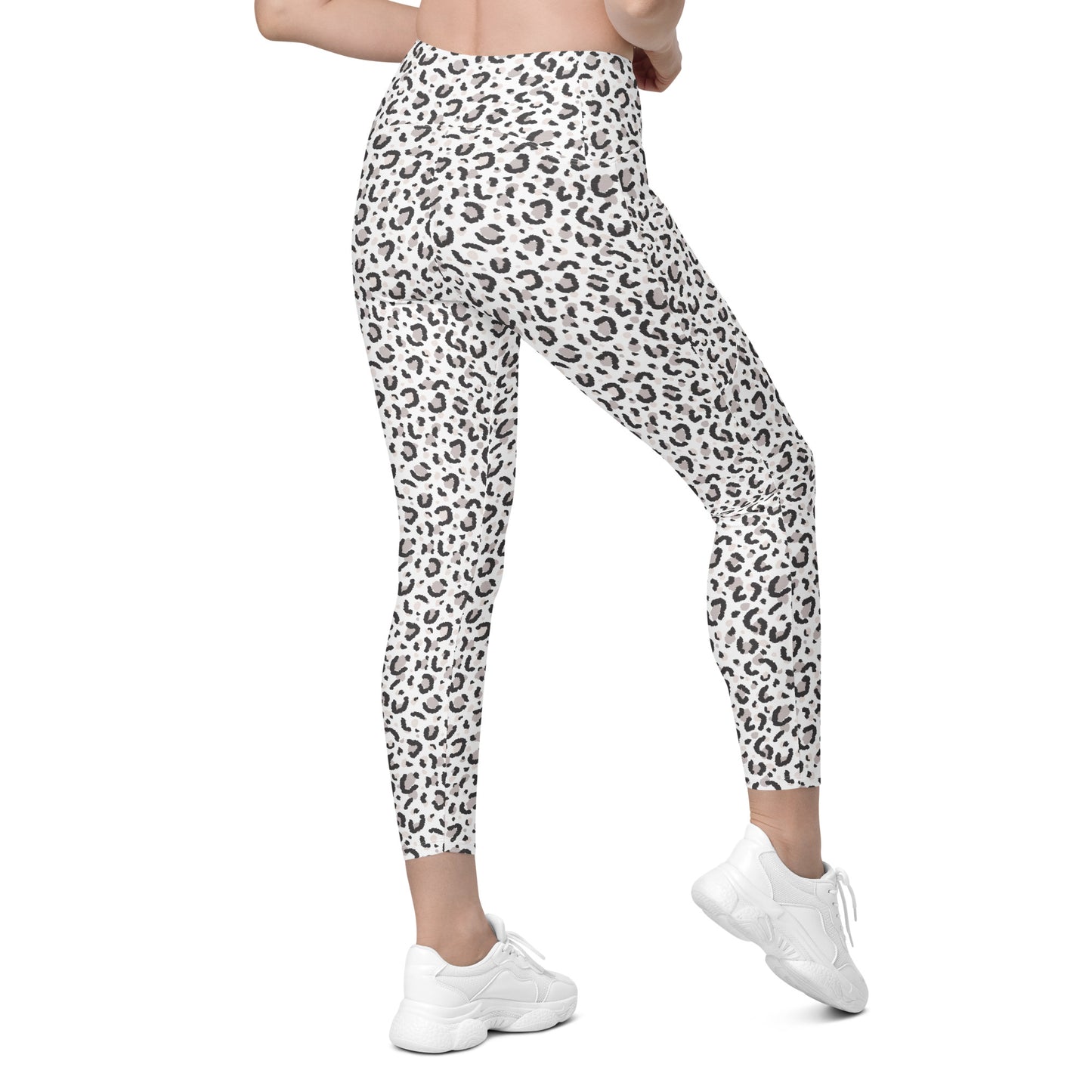 White high-waisted leggings with a black leopard print pattern, shown on a model from the waist down wearing white sneakers against a plain white background. Elegant Comfortable Leopard Pattern Leggings with Pockets Activewear