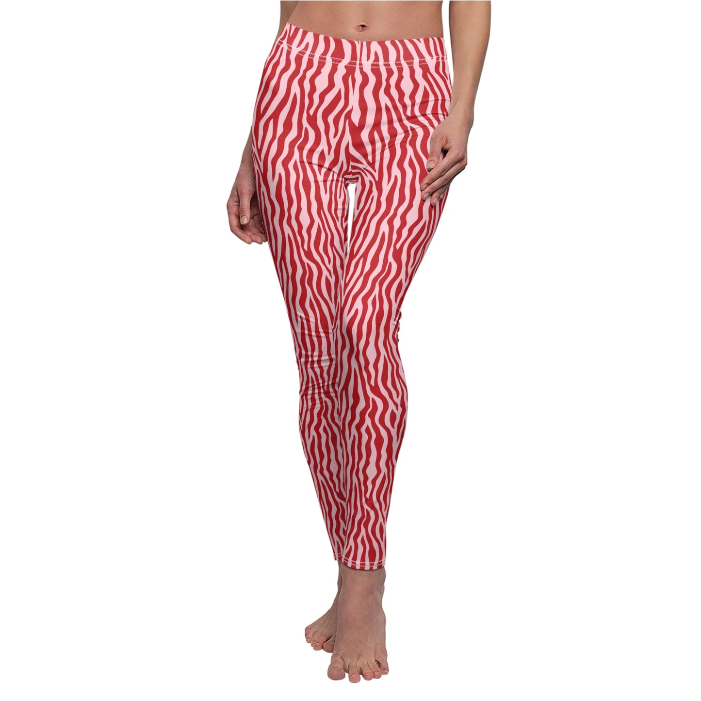 Red and white wavy zebra-print leggings shown on a model against a plain white background. Eye-Catching Leggings with Bold Zebra Print
