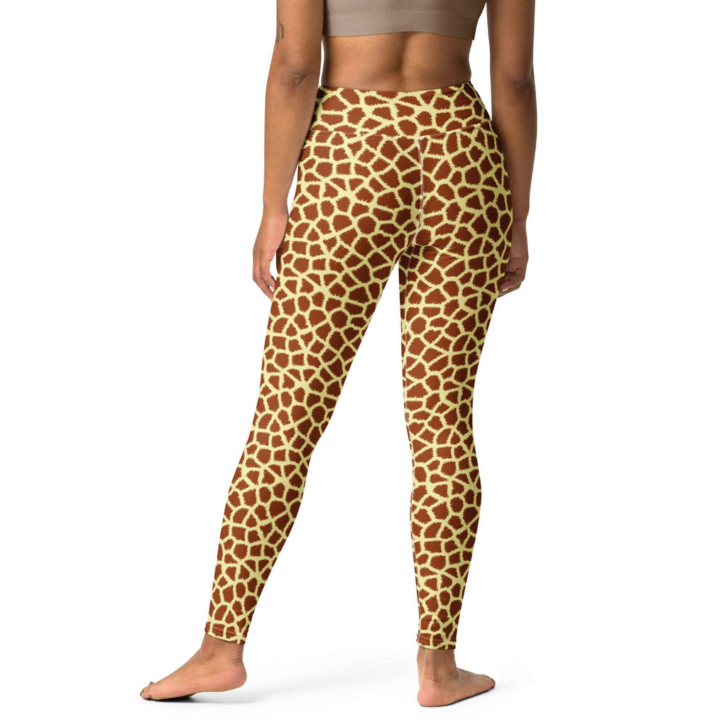 Rear view of a model wearing high-waisted leggings with a brown and beige giraffe print pattern, set against a plain white background. Fashionable Stylish Giraffe Print Yoga Pants for Active Wear