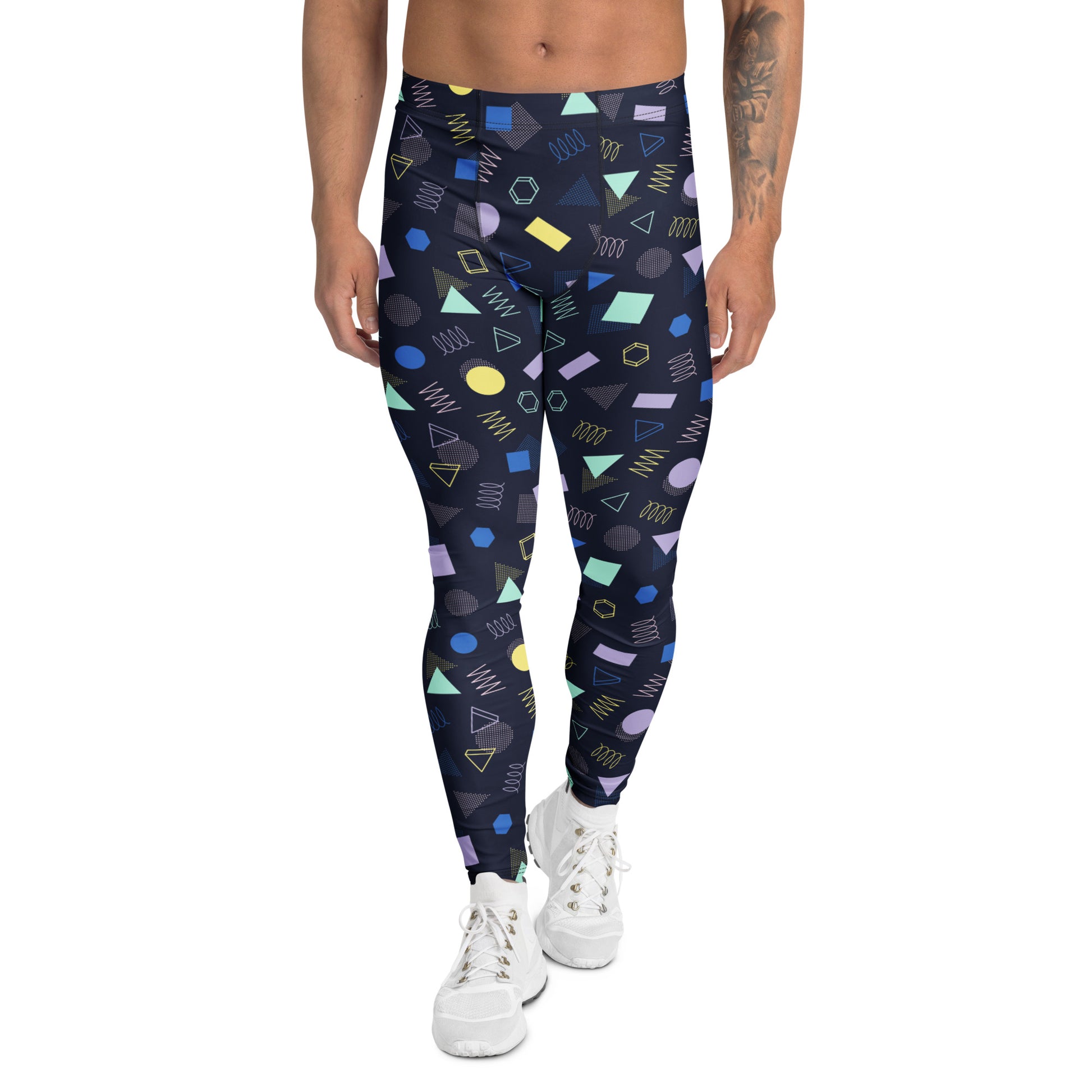 A person modeling high-waisted leggings with a colorful geometric pattern on a dark navy base, paired with white sneakers against a plain white background. Minimalist Bold Aesthetic Geometric Memphis Men's Leggings