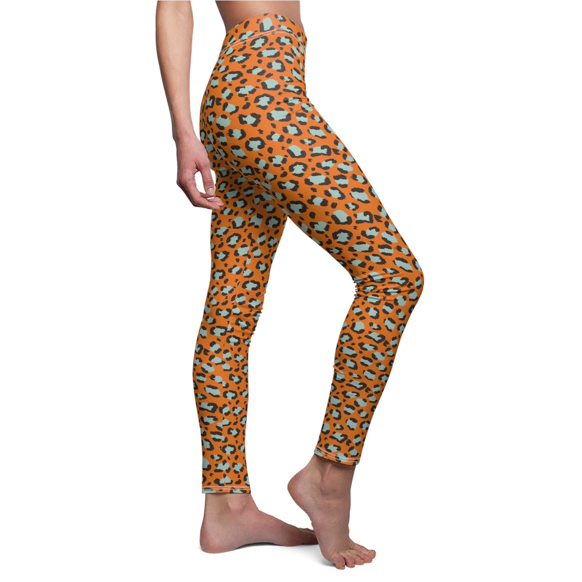 A person modeling high-waisted leggings with an orange leopard print pattern featuring black and light blue-gray spots, shown against a plain white background. Minimalist Bold Orange Leopard Print Women's Casual Leggings