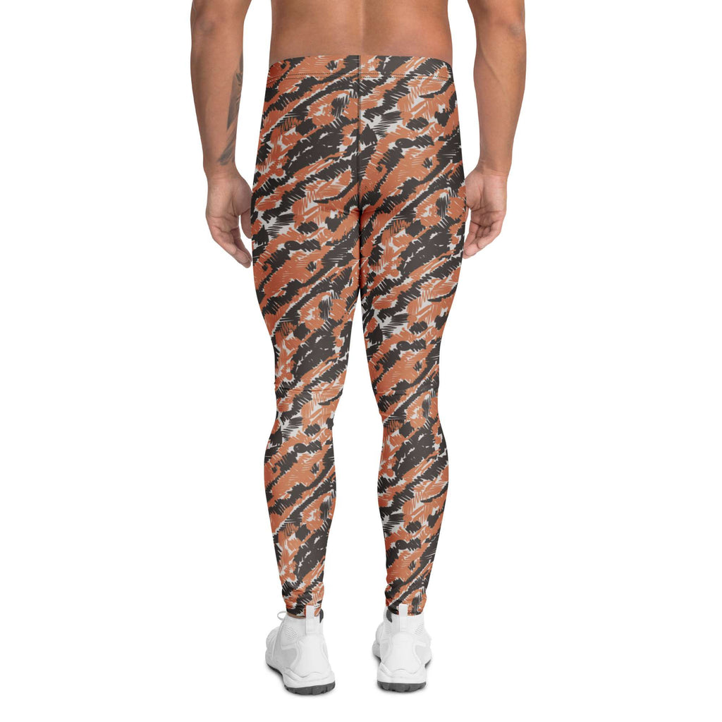 A person shown from the waist down wearing full-length athletic leggings with an orange, black, and gray tiger-stripe camouflage pattern, paired with white sneakers on a plain white background. Modern Bold Artistic Brush Stroke Pattern Men's Athletic Leggings