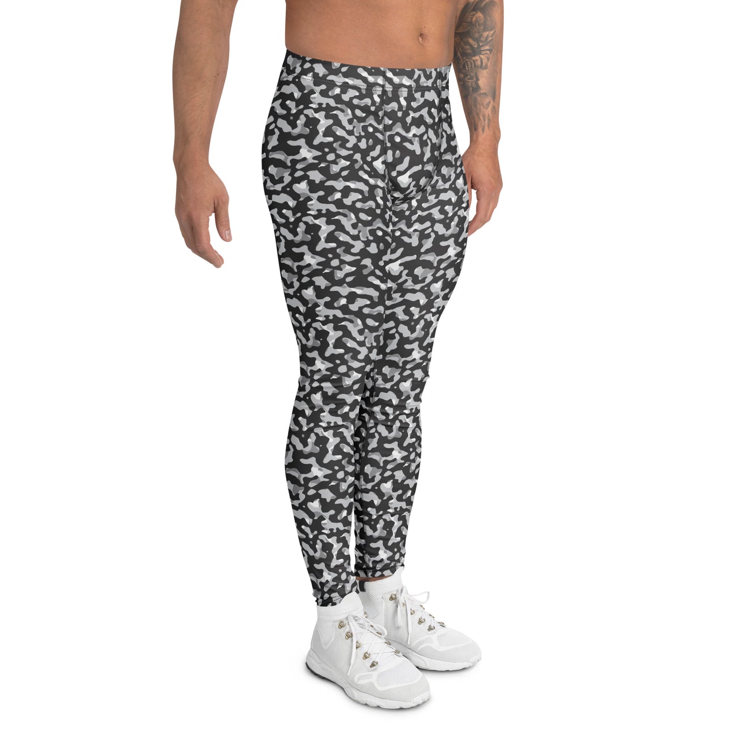 A model wearing black and white camouflage athletic leggings with white sneakers, shown from the waist down on a solid white background. Monochrome Black and White Urban Camouflage Men's Leggings Activewear