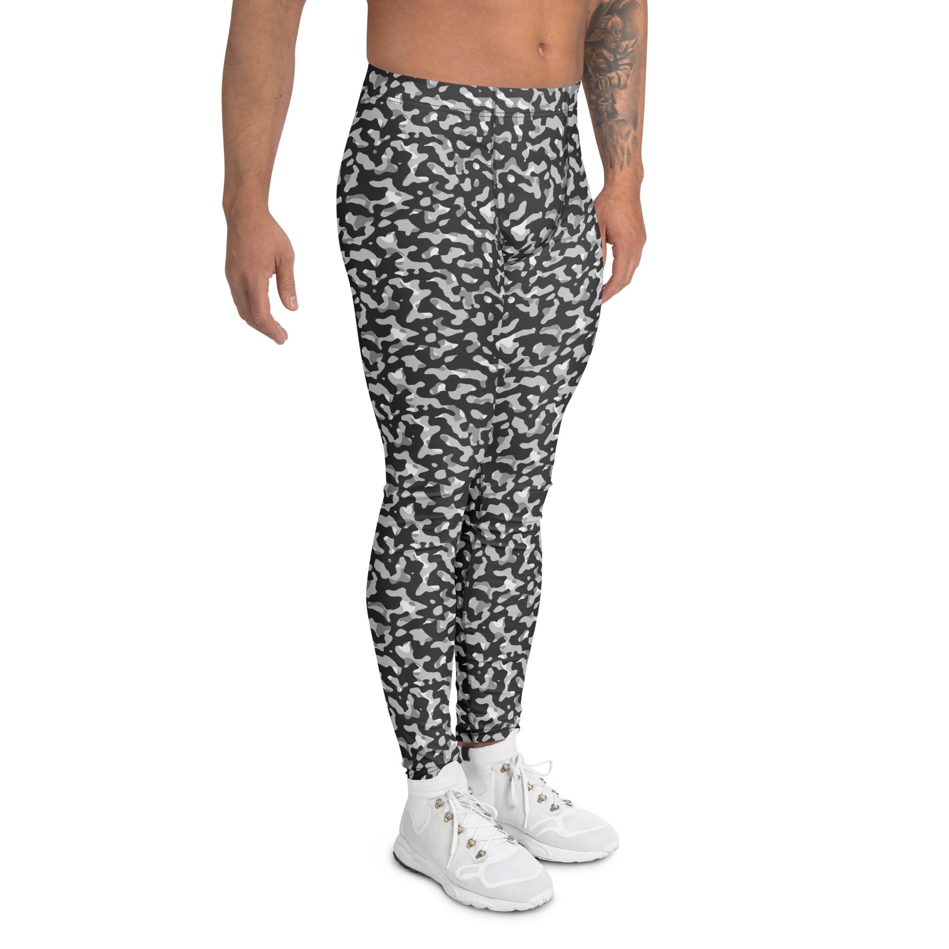 A model wearing black and white camouflage athletic leggings with white sneakers, shown from the waist down on a solid white background. Monochrome Black and White Urban Camouflage Men's Leggings Activewear