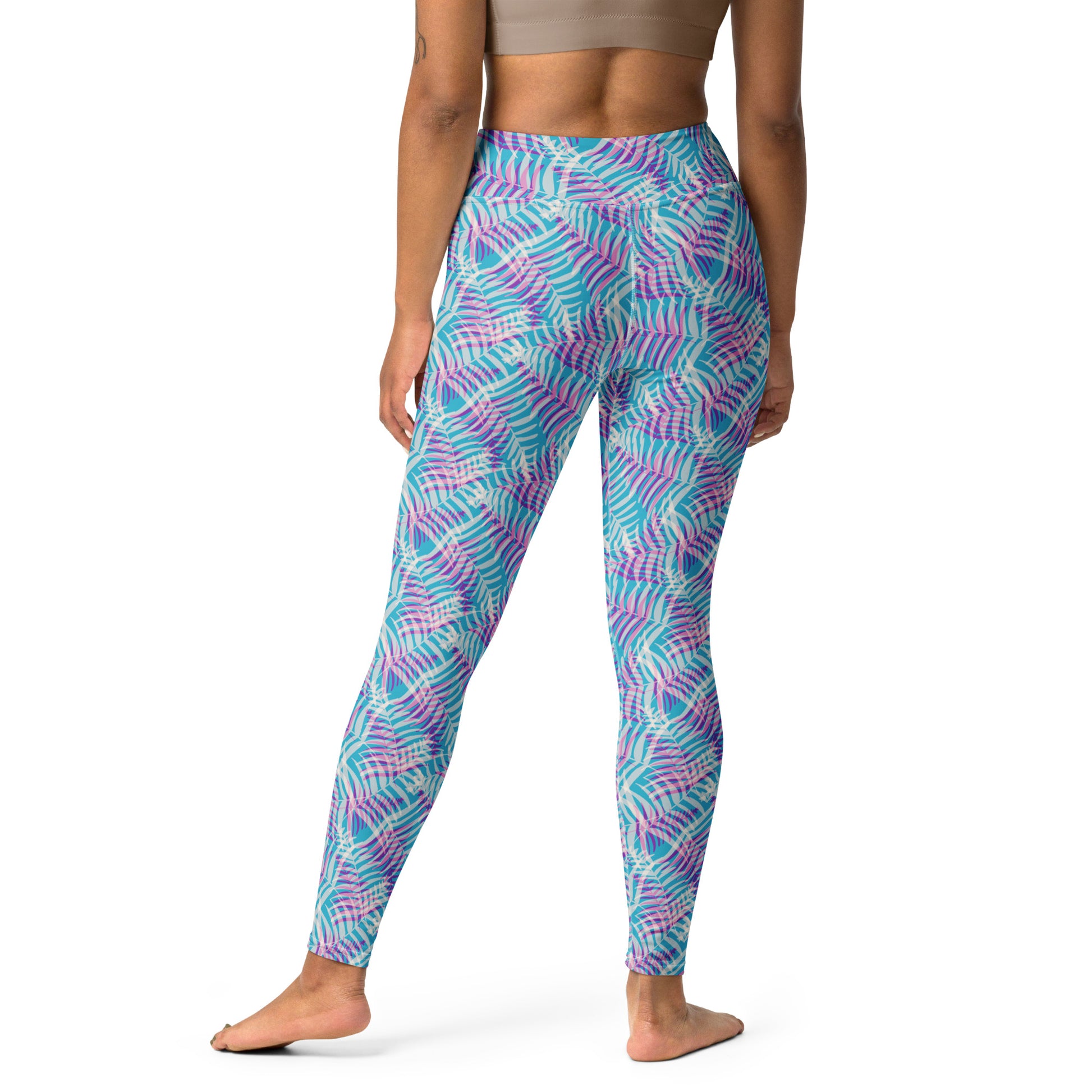 A model shown from the back wearing high-waisted leggings with a vibrant abstract wavy pattern in turquoise, purple, and pink, set against a plain white background. Stylish Bold Pastel Palm Print Activewear Yoga Leggings