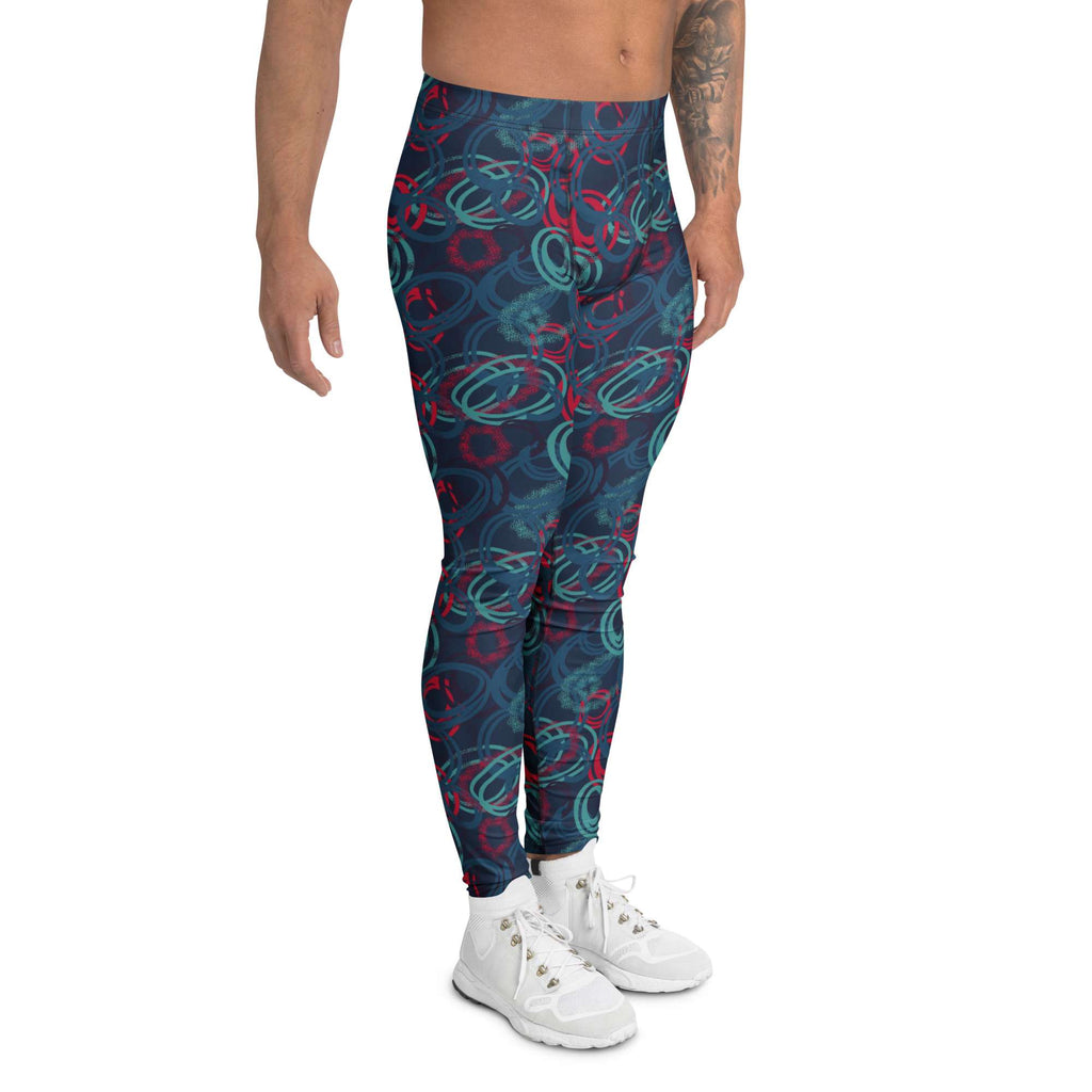 A model from the waist down wearing high-waisted leggings with a dark teal abstract swirl pattern in red and light teal, paired with white sneakers against a plain white background. Stylish Bold Vibrant Geometric Shapes Men's Athletic Leggings Activewear