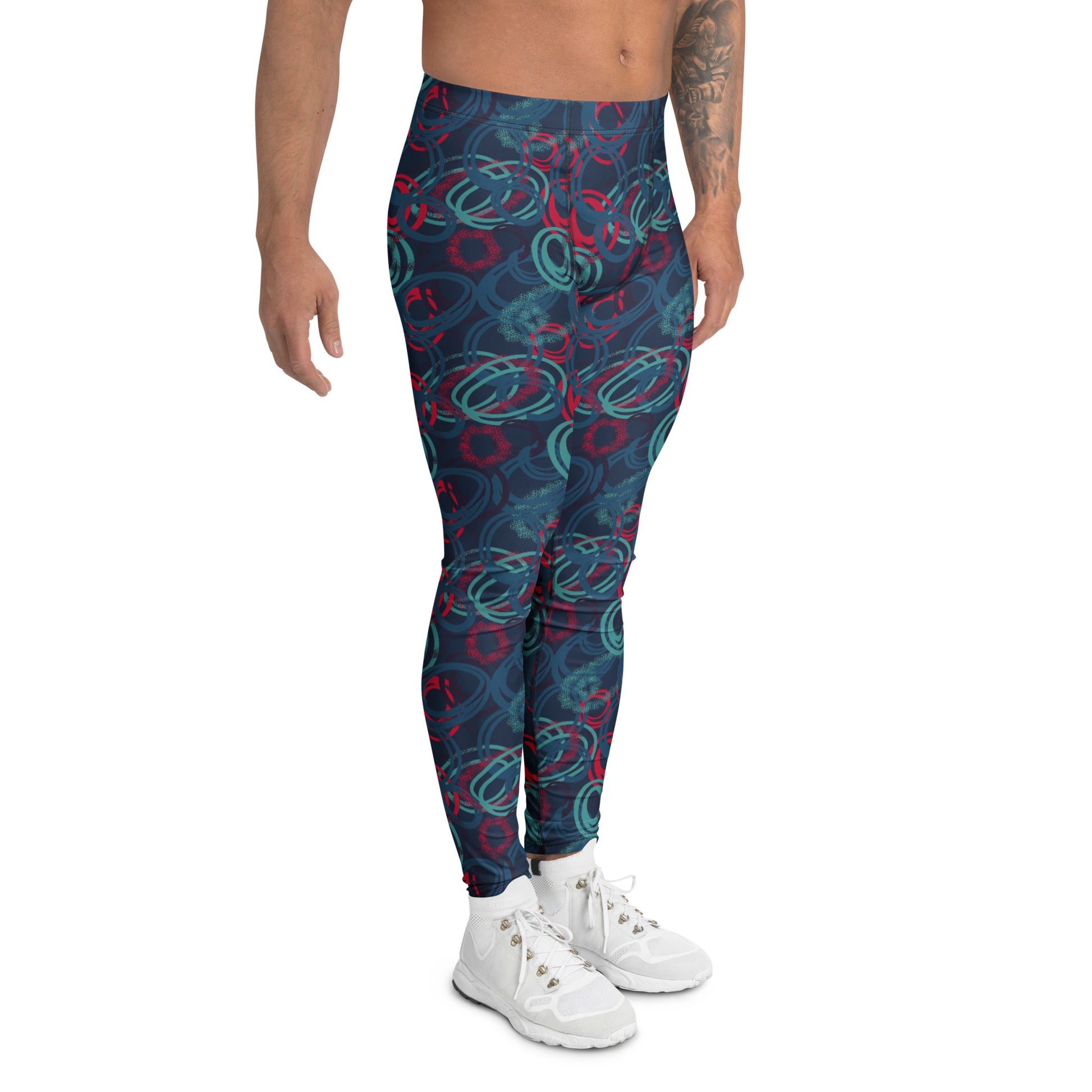 A model from the waist down wearing high-waisted leggings with a dark teal abstract swirl pattern in red and light teal, paired with white sneakers against a plain white background. Stylish Bold Vibrant Geometric Shapes Men's Athletic Leggings Activewear