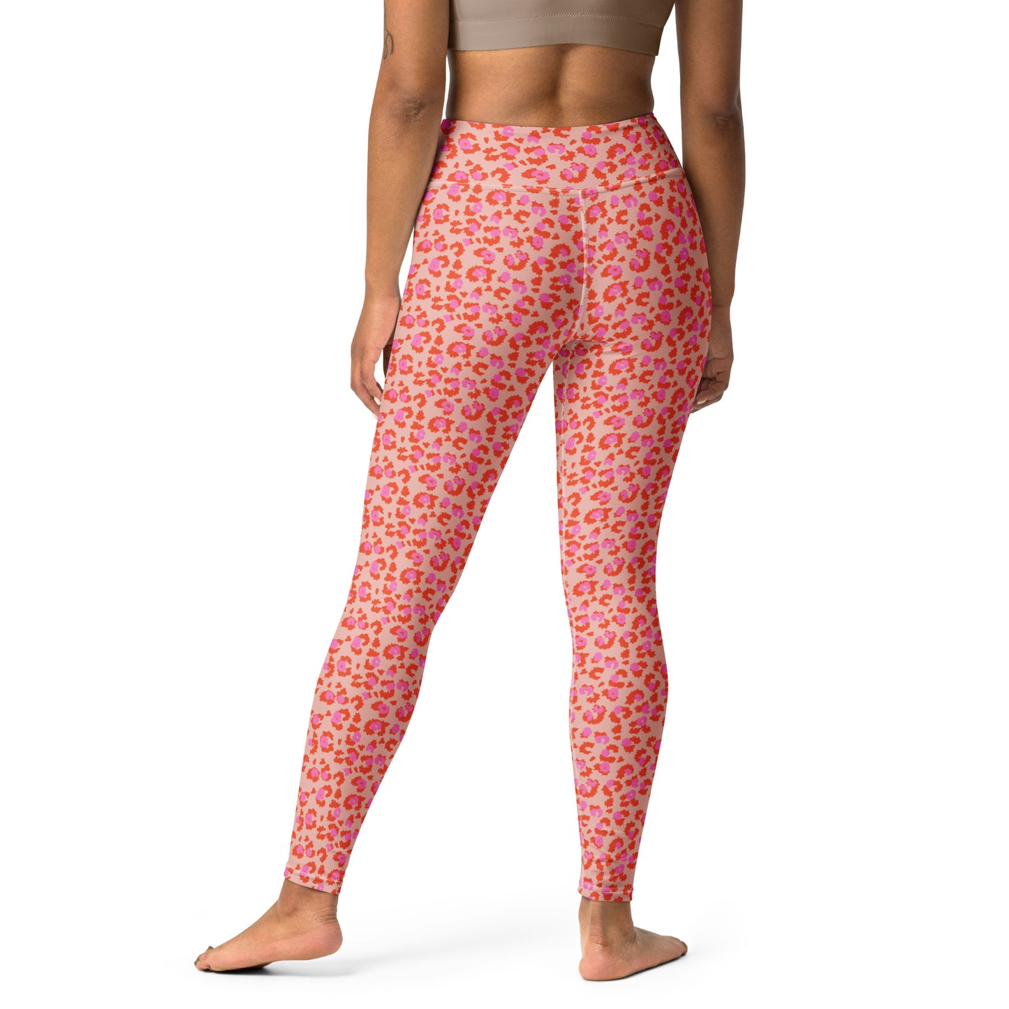 A model shown from the back wearing pink leggings with a red and orange leopard print pattern, standing against a plain white background. Stylish Chic Pink Leopard Print Yoga Pants for Workouts Activewear