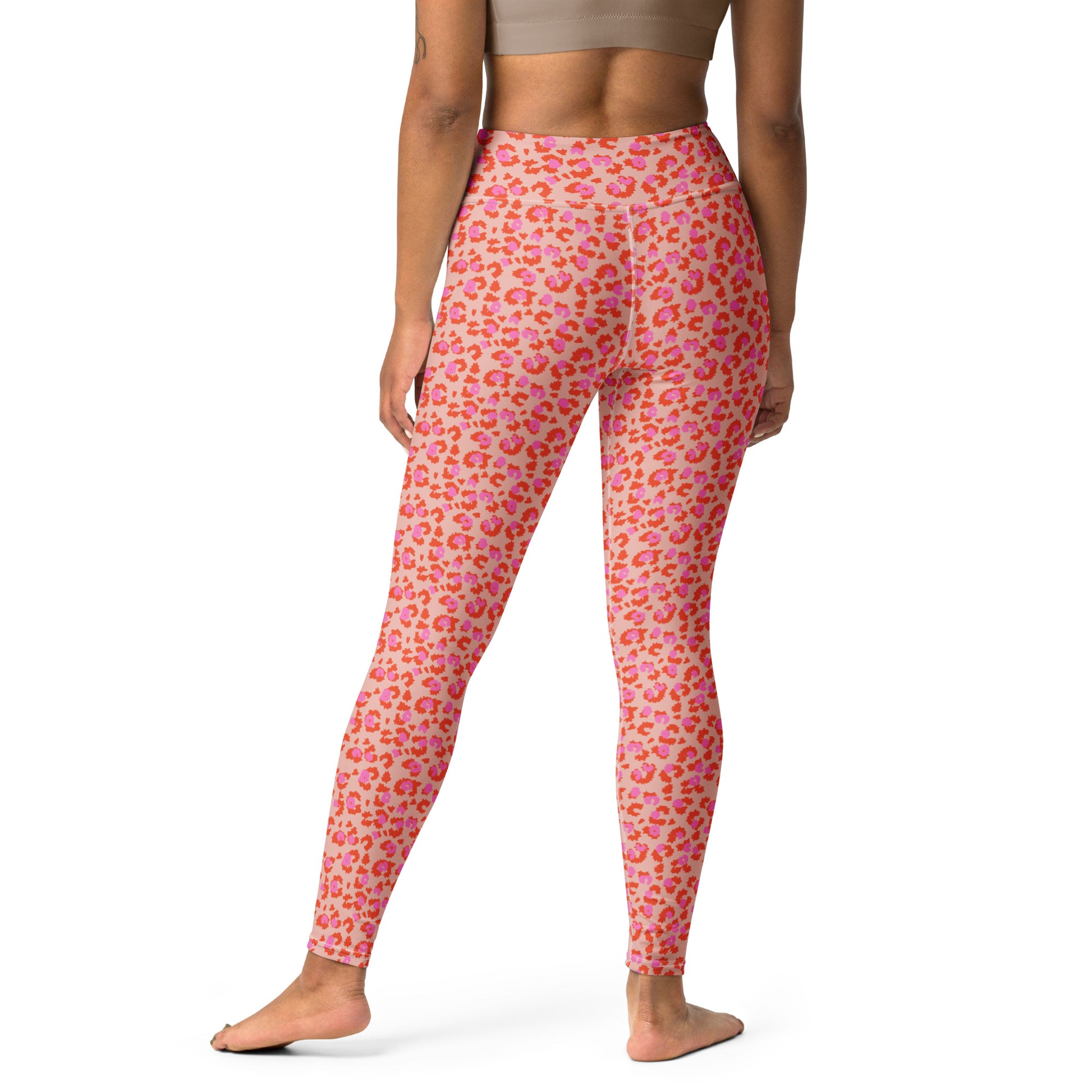 A model shown from the back wearing pink leggings with a red and orange leopard print pattern, standing against a plain white background. Stylish Chic Pink Leopard Print Yoga Pants for Workouts Activewear