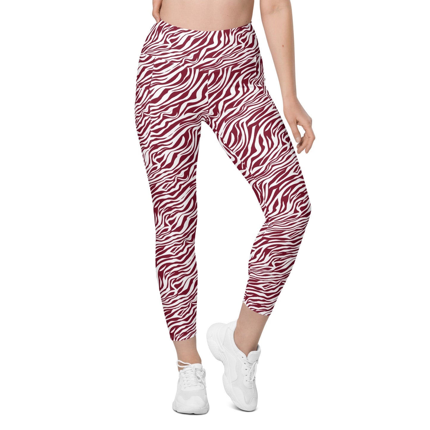 A model from the waist down wearing red and white zebra-print leggings and white sneakers, shown against a plain white background. Stylish Comfortable Bold Red Zebra Print Leggings with Pockets for Activewear