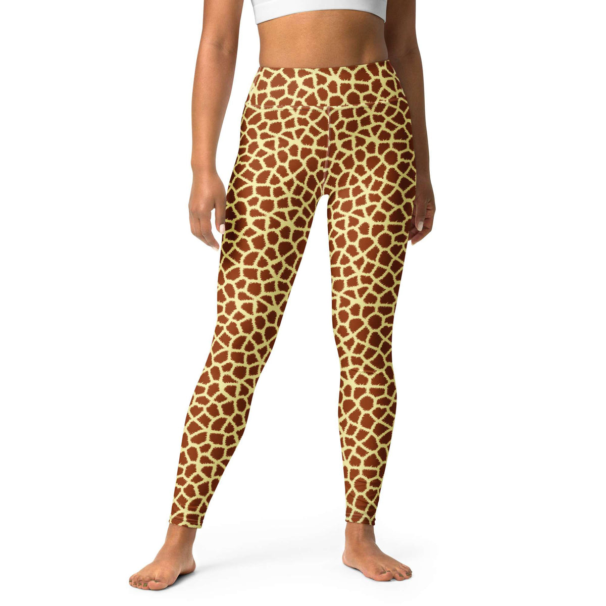 A model wearing high-waisted leggings with a brown and beige giraffe print pattern, shown from the waist down on a white background. Stylish Giraffe Print Yoga Pants for Active Wear