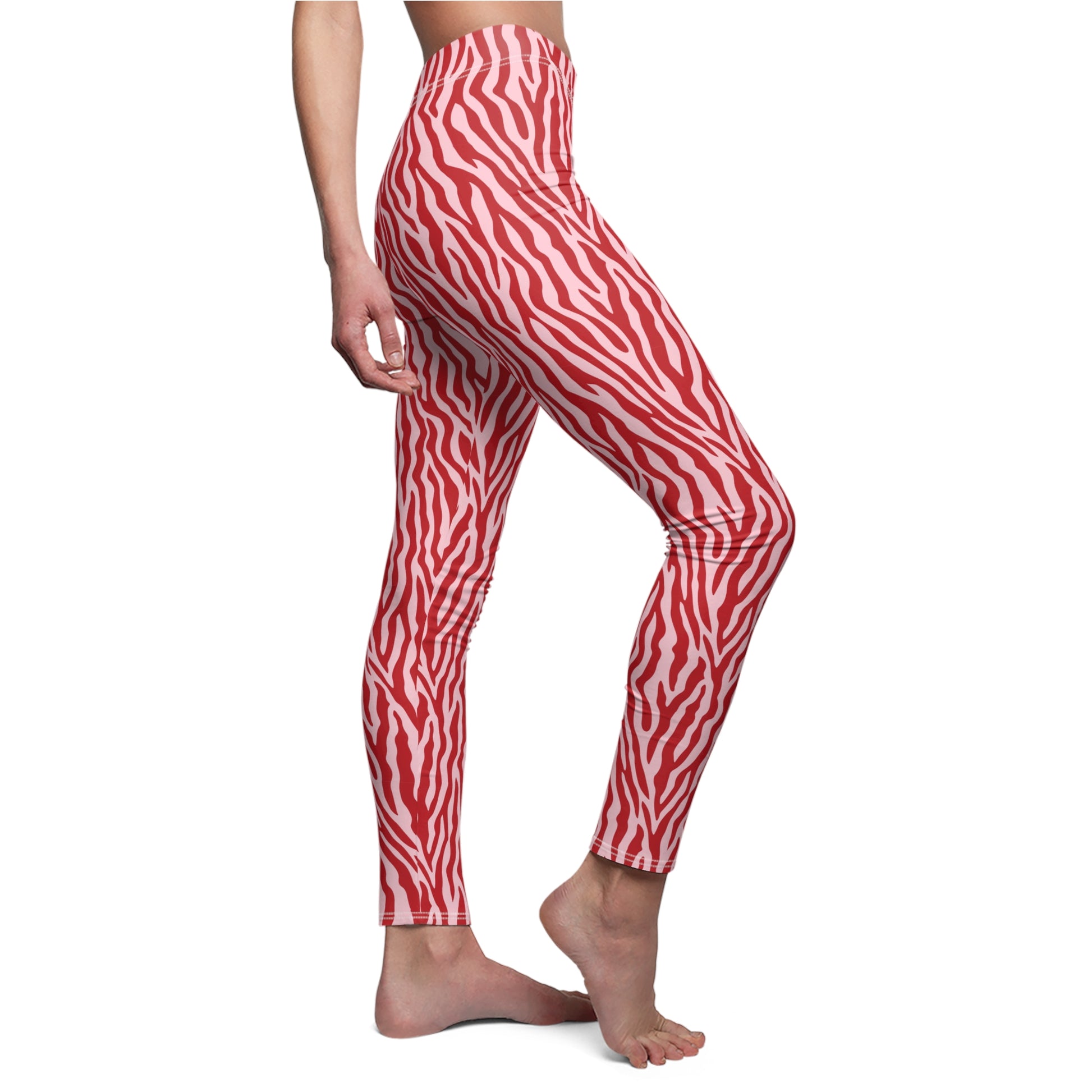 Red and white zebra-print leggings shown on a model from the waist down against a plain white background. Stylish Pink Zebra Stripe Leggings for Workouts