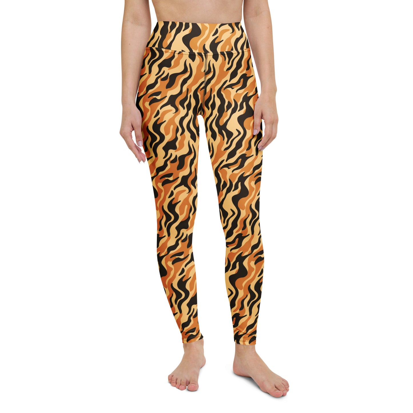 A model wearing high-waisted leggings with a bold orange and black wavy tiger-stripe pattern, shown against a plain white background. Stylish Yoga Leggings with Bold Tiger Print Design