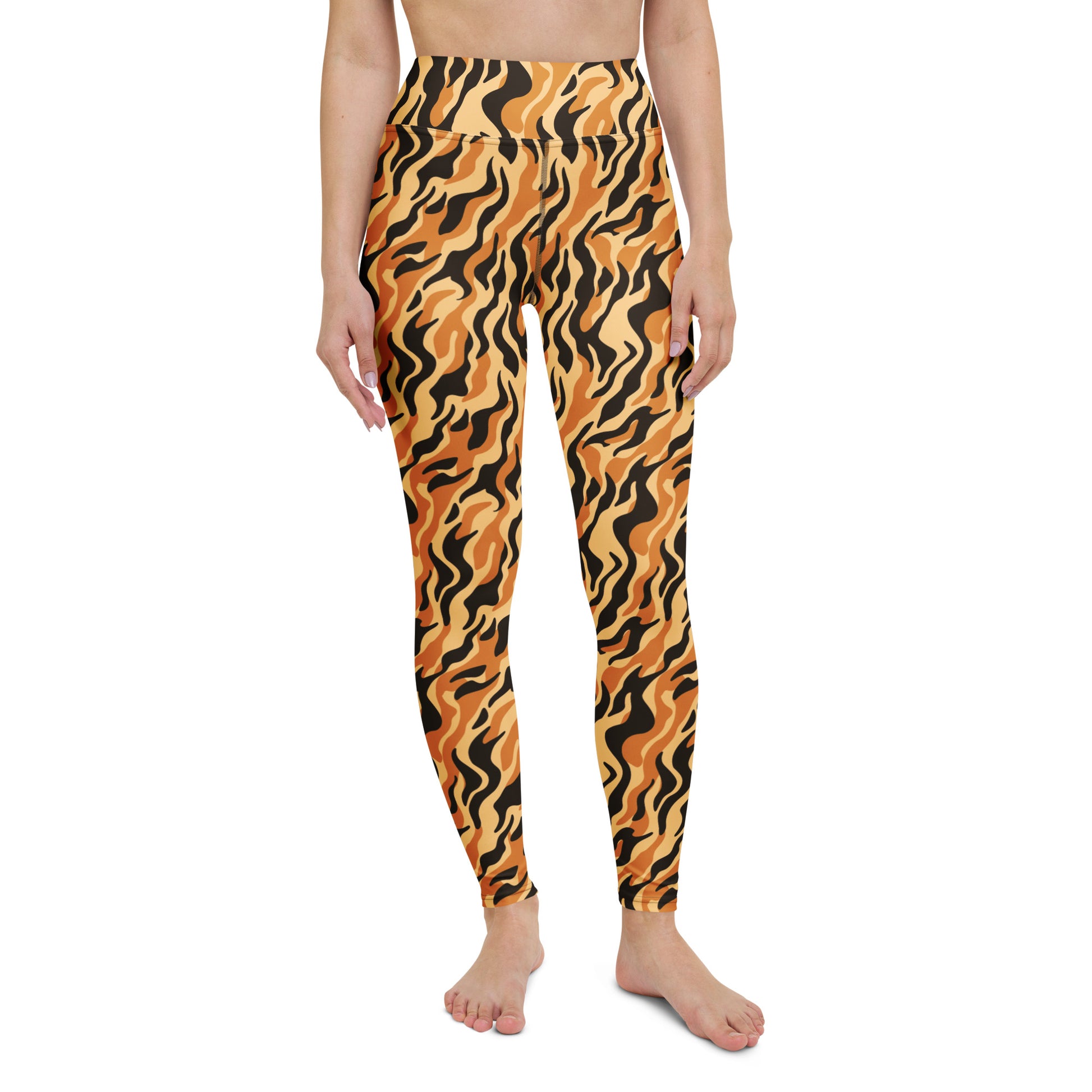 A model wearing high-waisted leggings with a bold orange and black wavy tiger-stripe pattern, shown against a plain white background. Stylish Yoga Leggings with Bold Tiger Print Design
