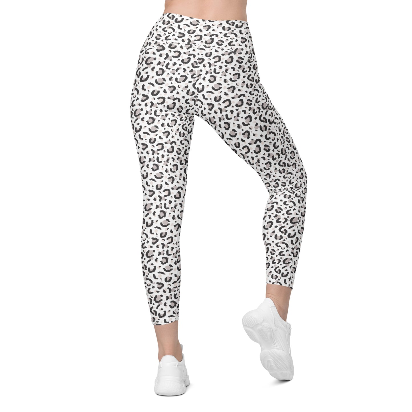 White high-waisted leggings with a black leopard print pattern, shown on a model from the waist down wearing white sneakers against a plain white background. Trendy Comfortable Leopard Pattern Leggings with Pockets Activewear