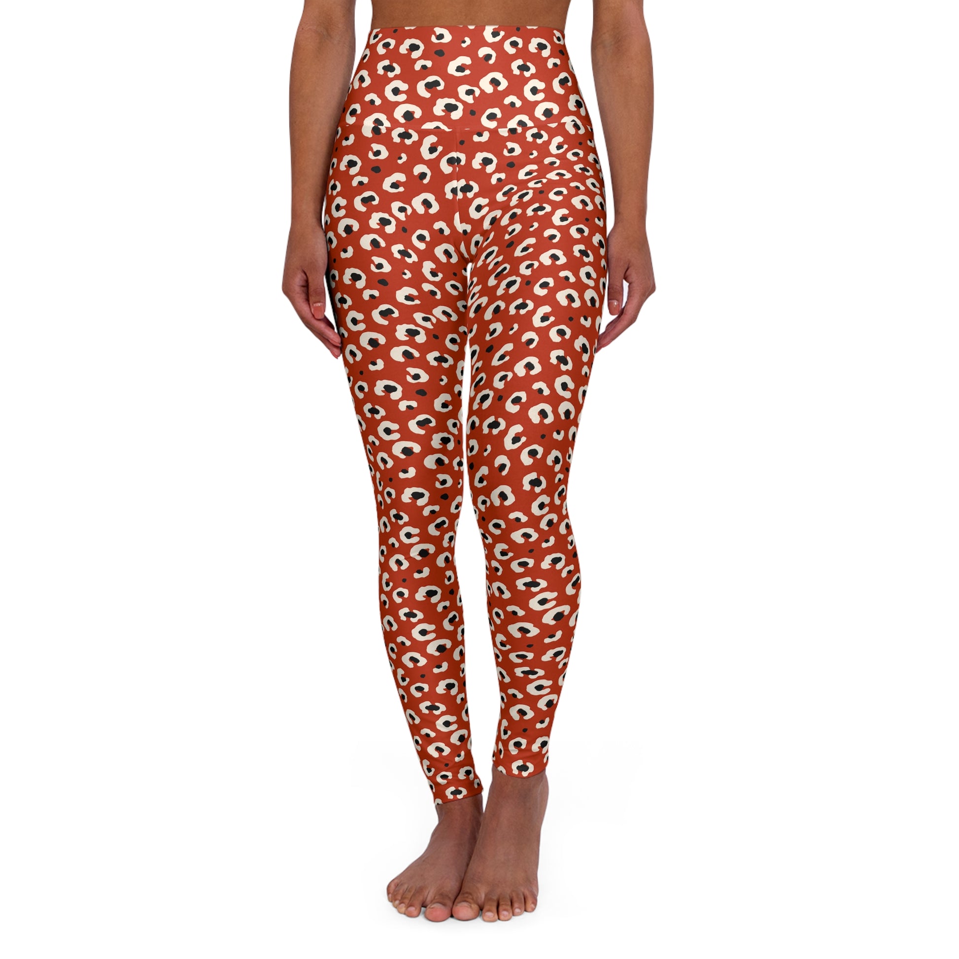 A person modeling high-waisted leggings with an all-over eye print on a solid white background. Tropical Leopard Print High-Waisted Yoga Leggings