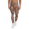 A person modeling high-waisted leggings with an orange, black, and gray tiger-stripe pattern, paired with white sneakers, shown against a plain white background. Unique Bold Artistic Brush Stroke Pattern Men's Athletic Leggings